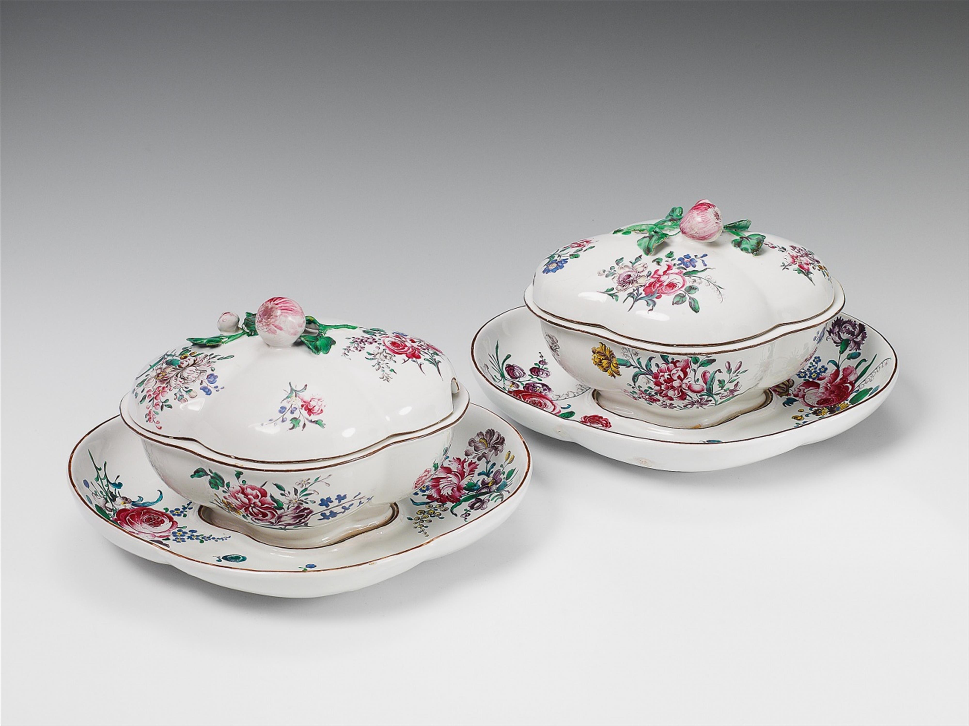 A rare pair of Strasbourg faience tureens and platters with floral overglaze decor. - image-1
