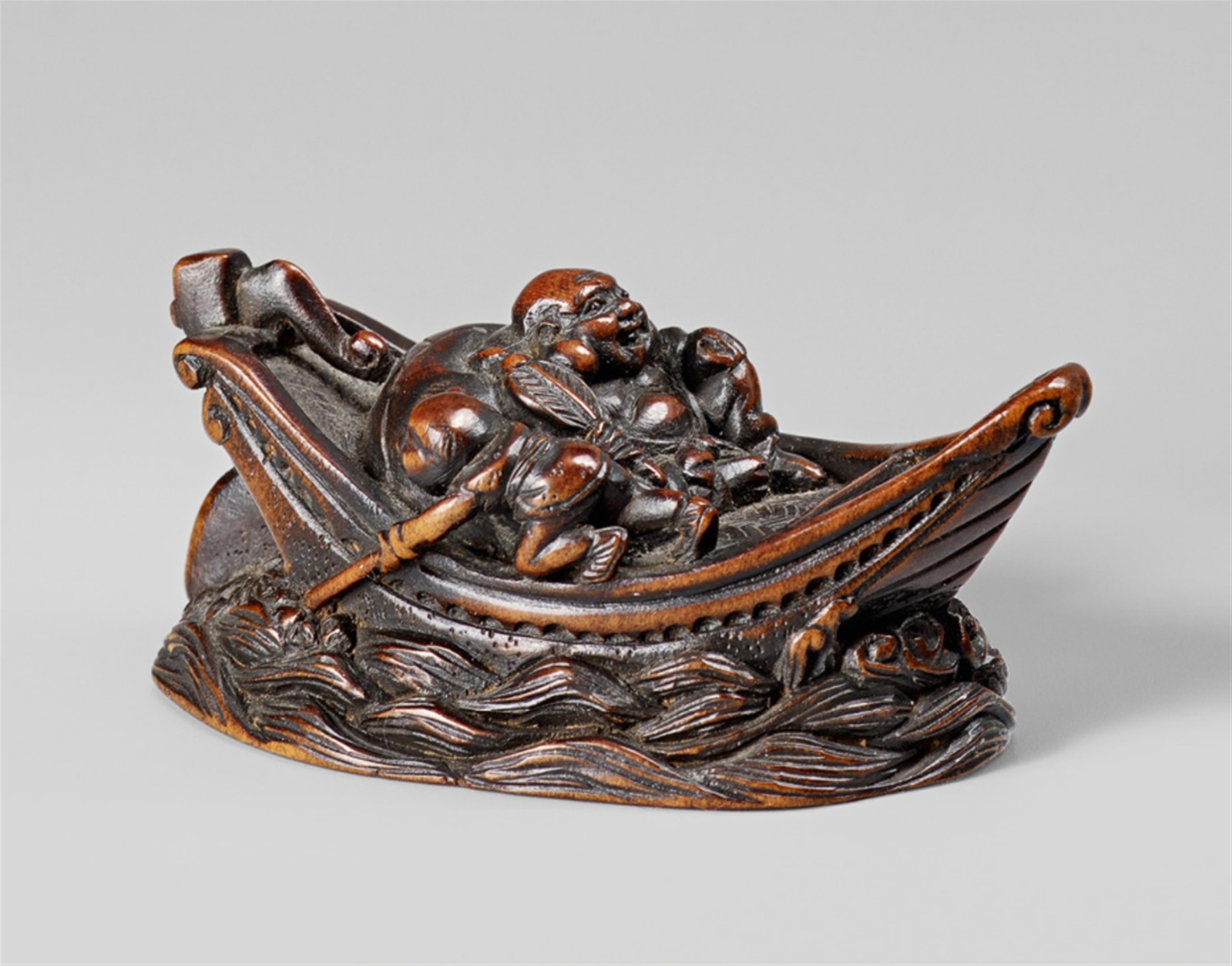 A boxwood netsuke of Hotei in a boat surrounded by waves. 19th century - image-1
