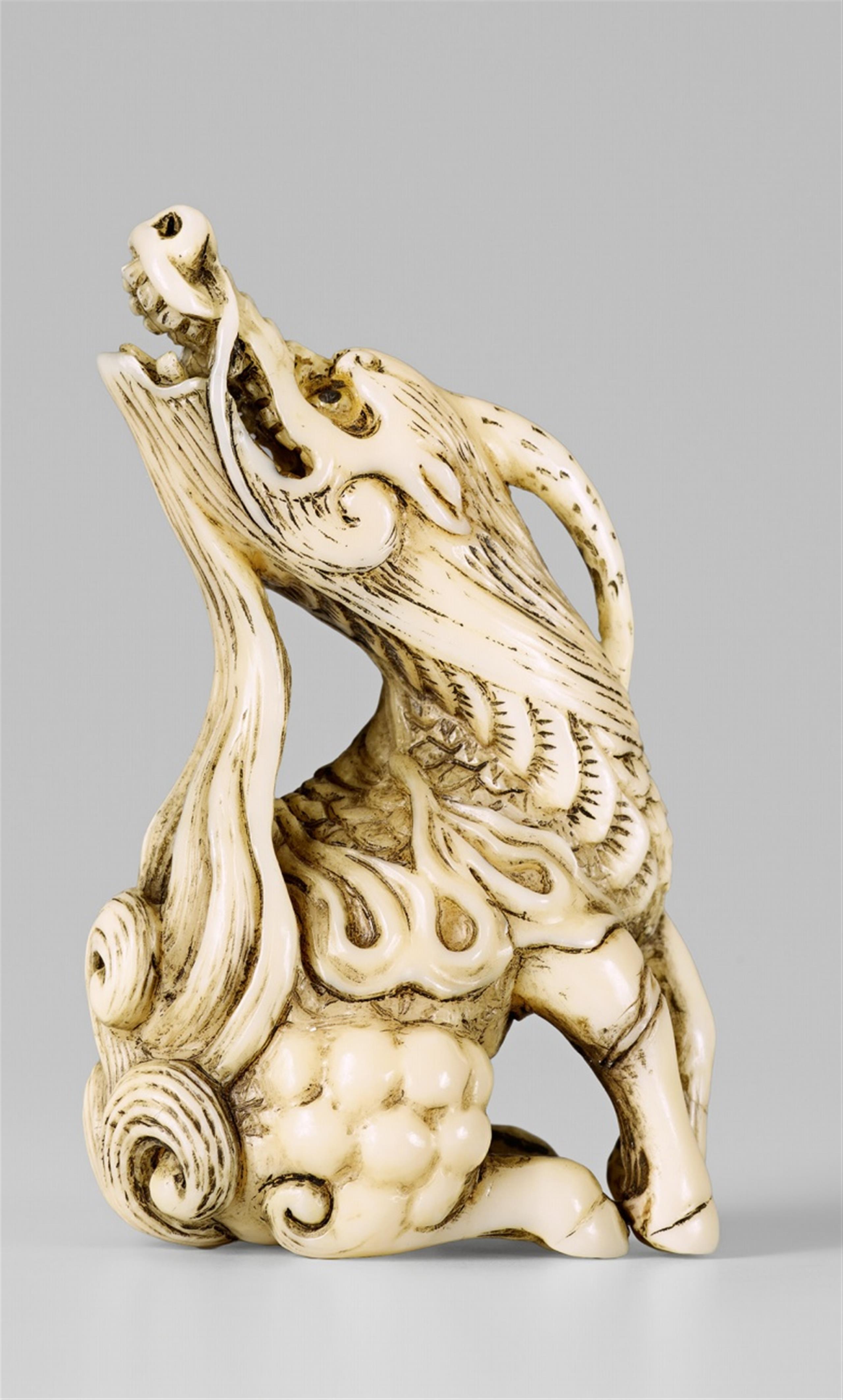 An ivory netsuke of a spirited kirin. 19th century - image-1