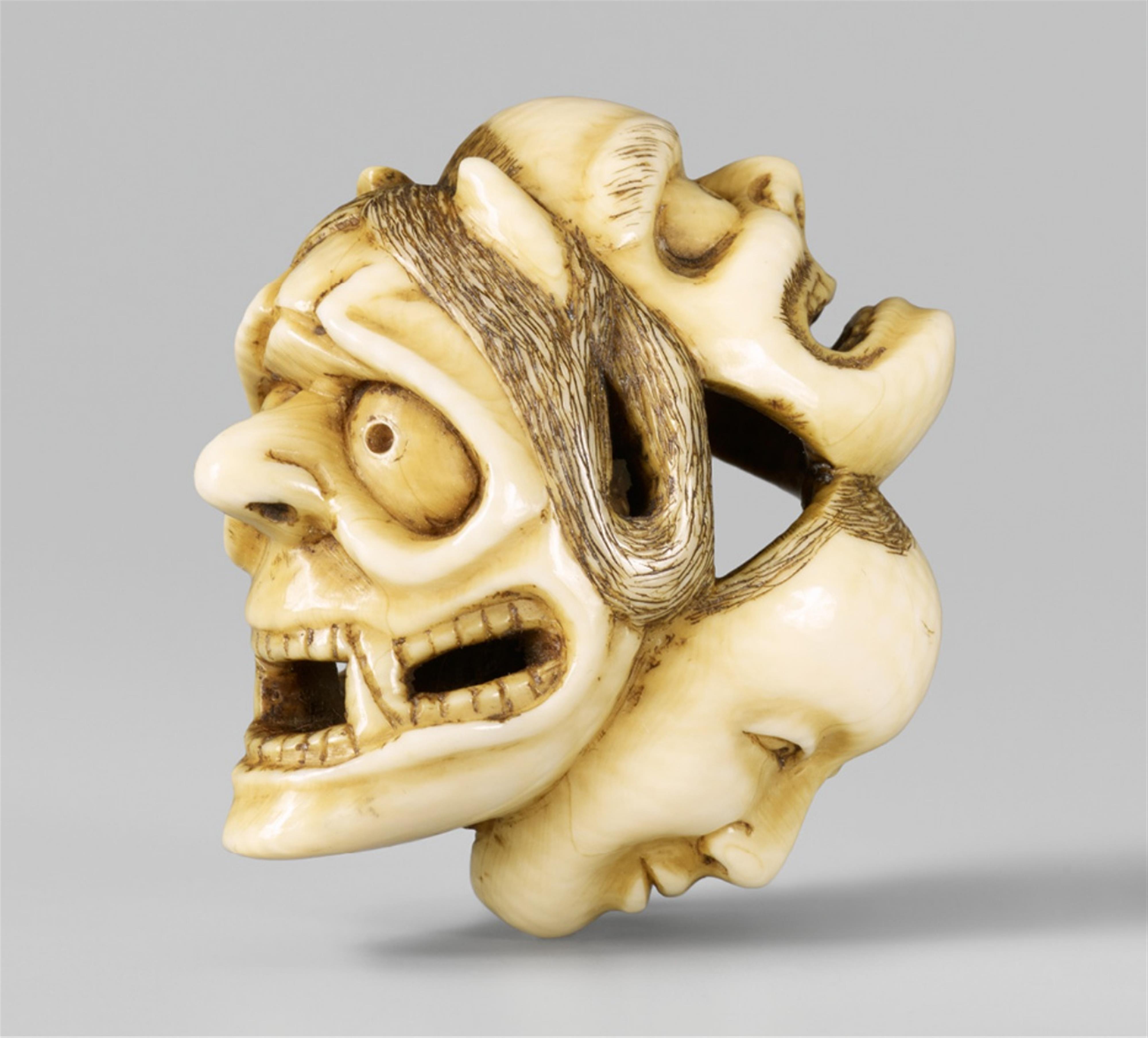 An ivory netsuke of three masks. Second half 19th century - image-1