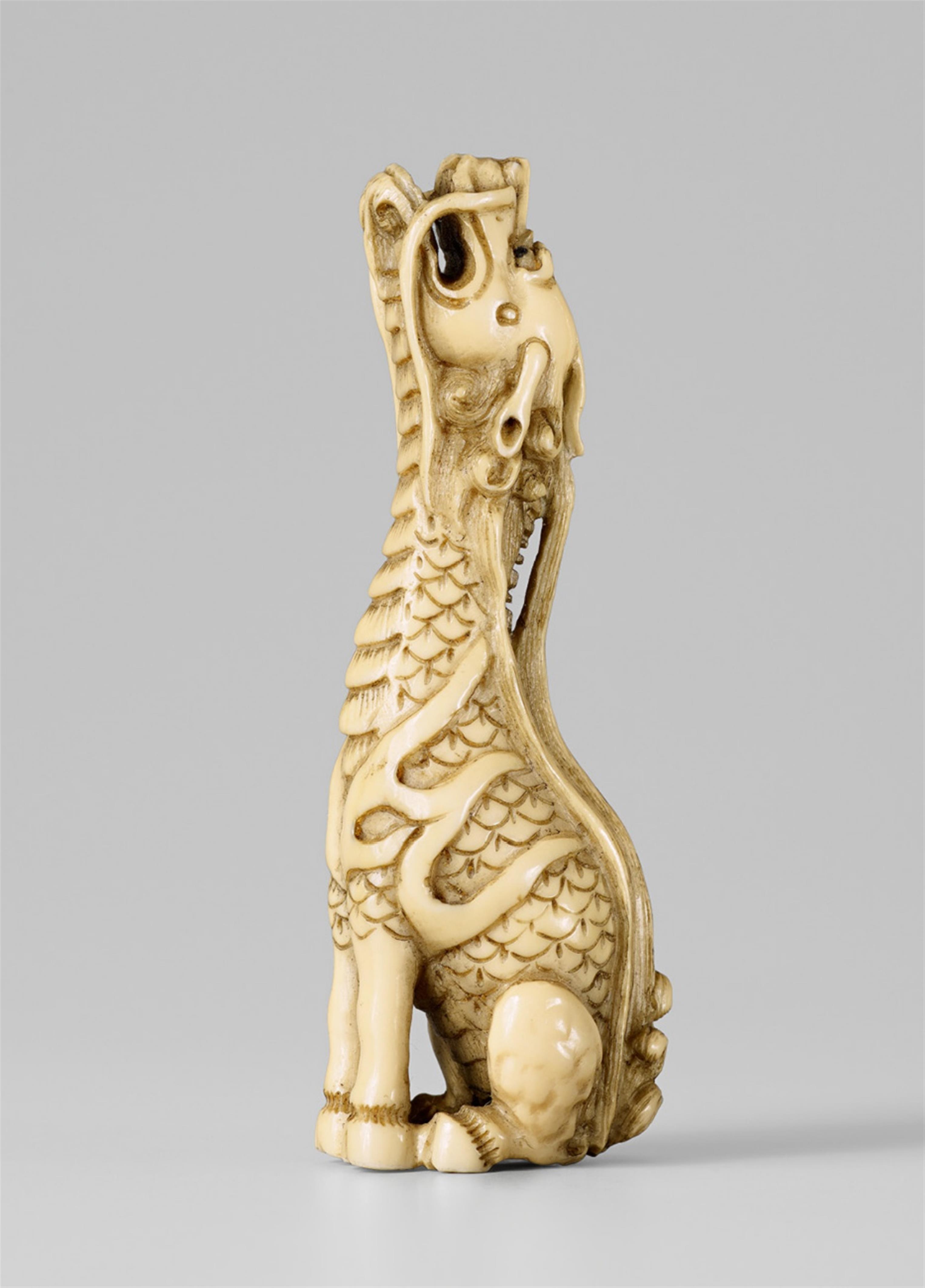 An ivory? netsuke of a slender kirin. Late 19th century - image-1