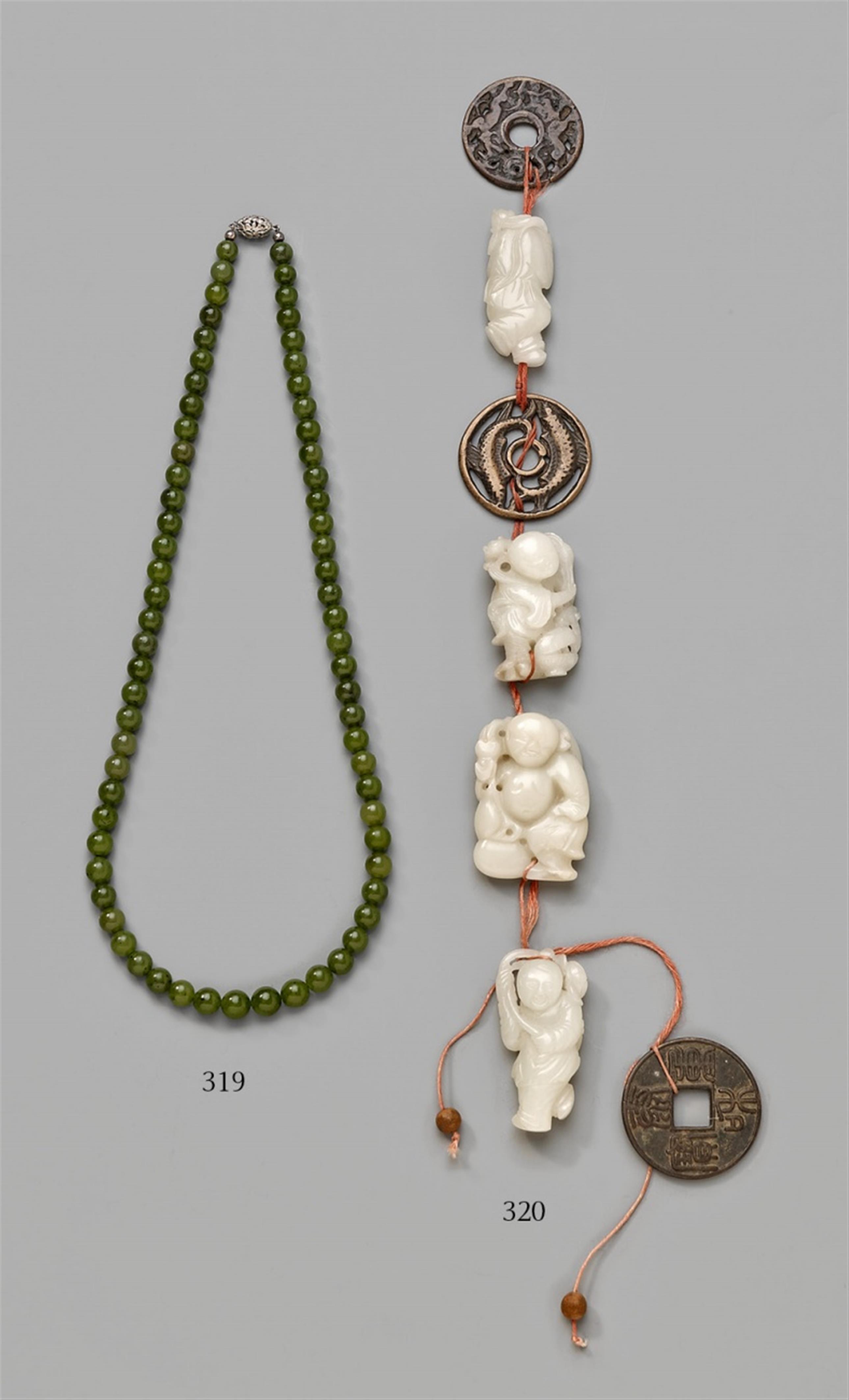 Four whitish jade pendants - image-1