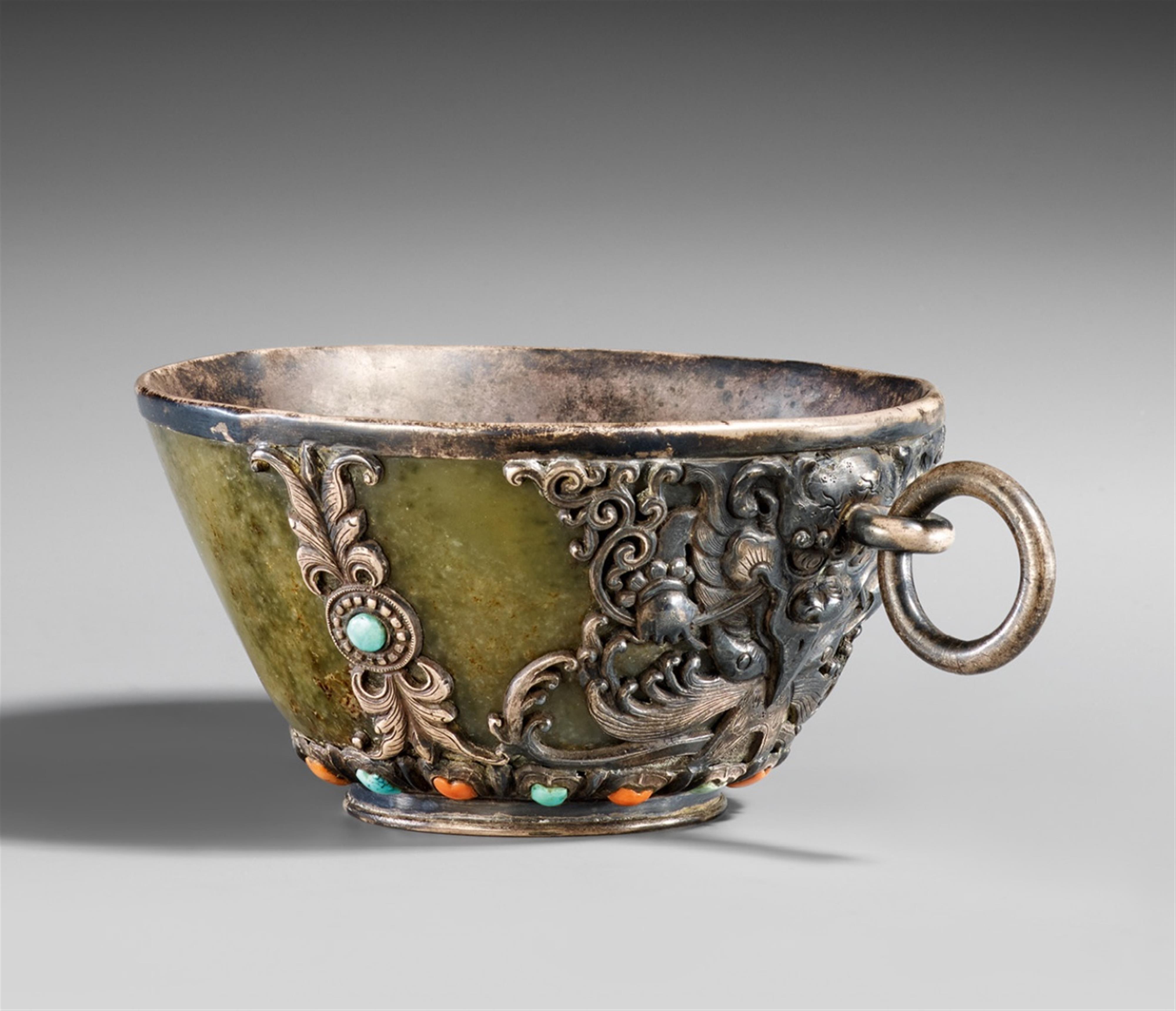A Mongolian green jade bowl with silver mounting. 19th/20th century - image-1