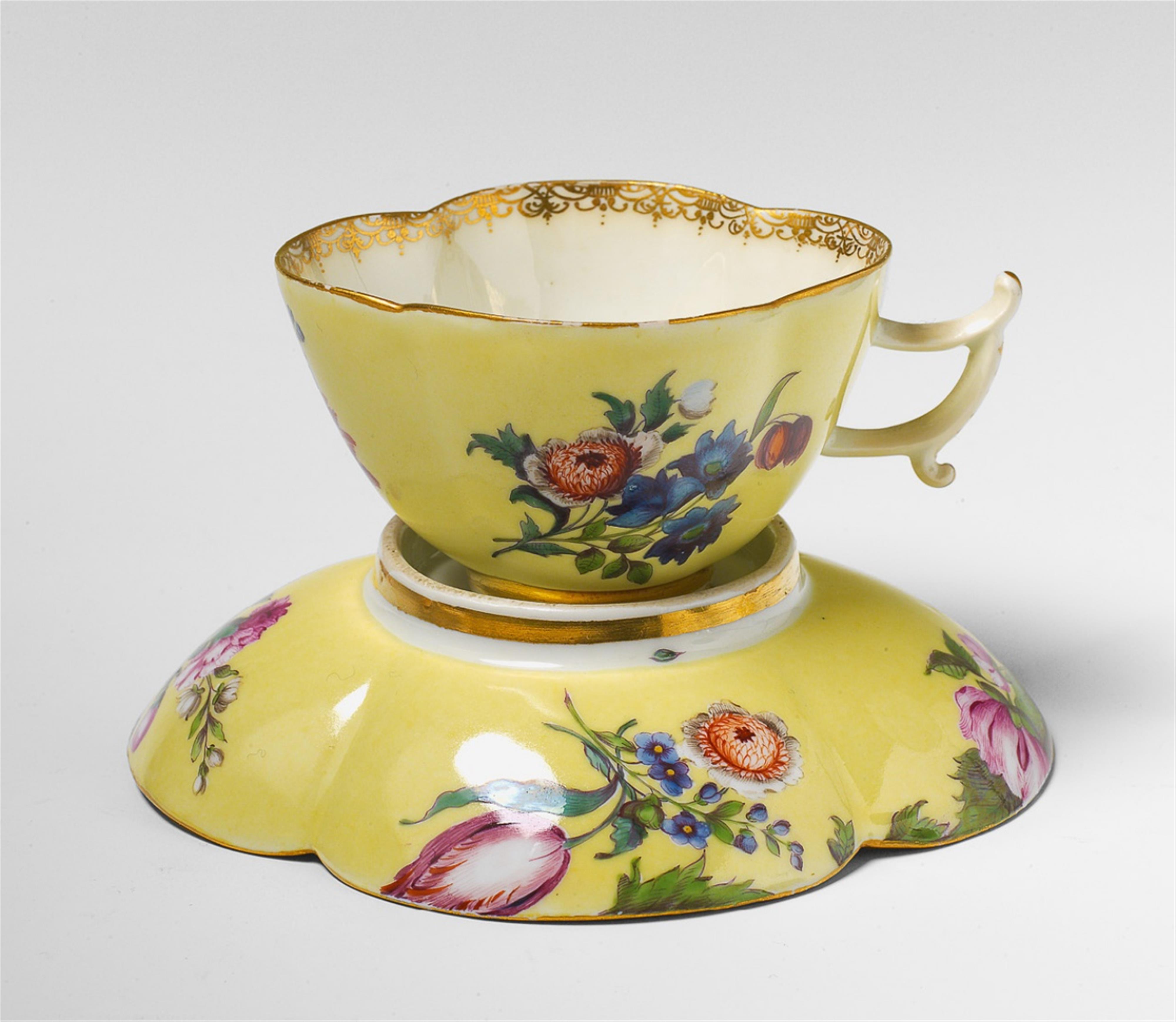 A Meissen porcelain gold ground teacup and saucer. - image-1