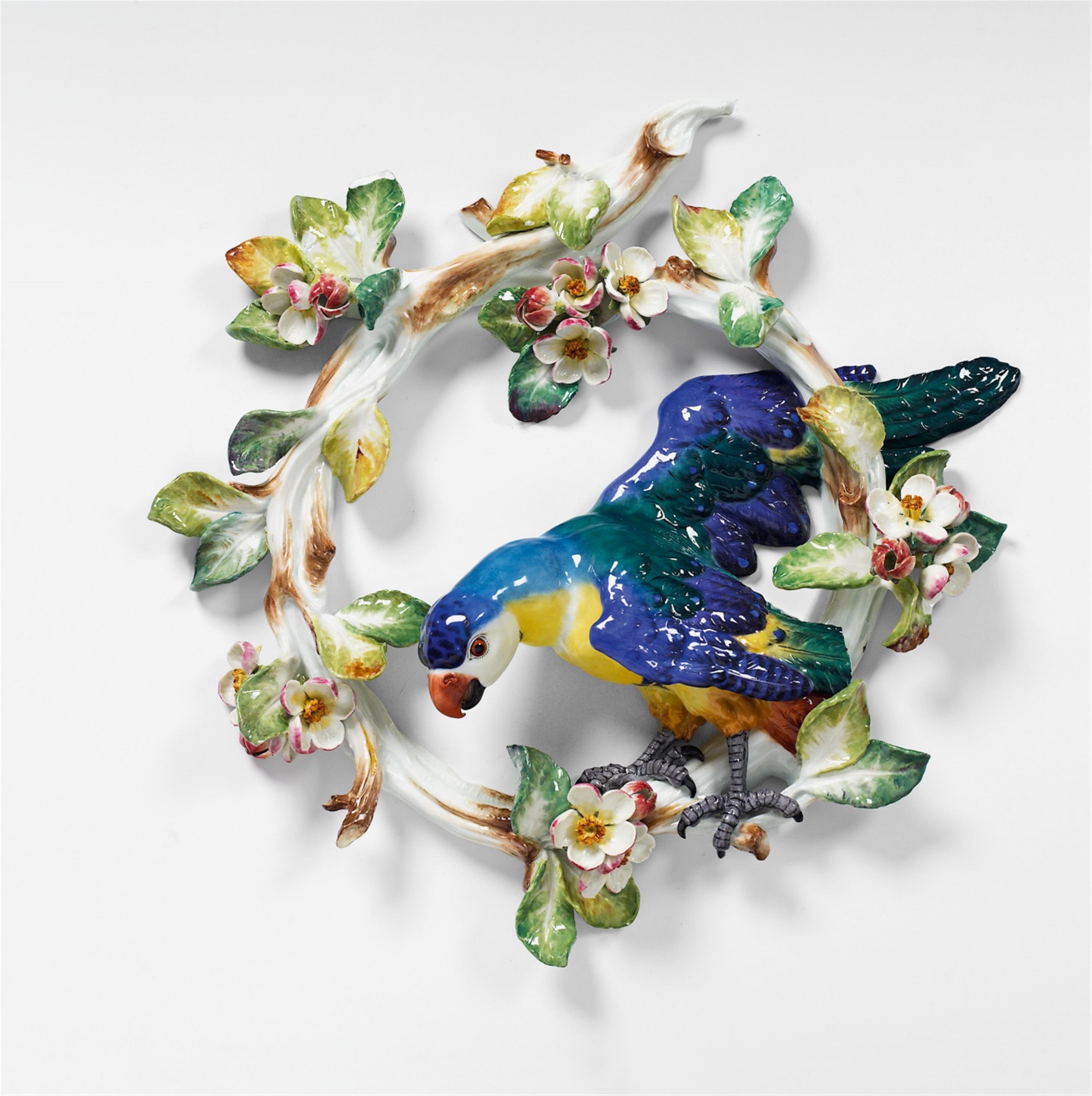 A Meissen porcelain wreath of apple blossom with a parrot. - image-1