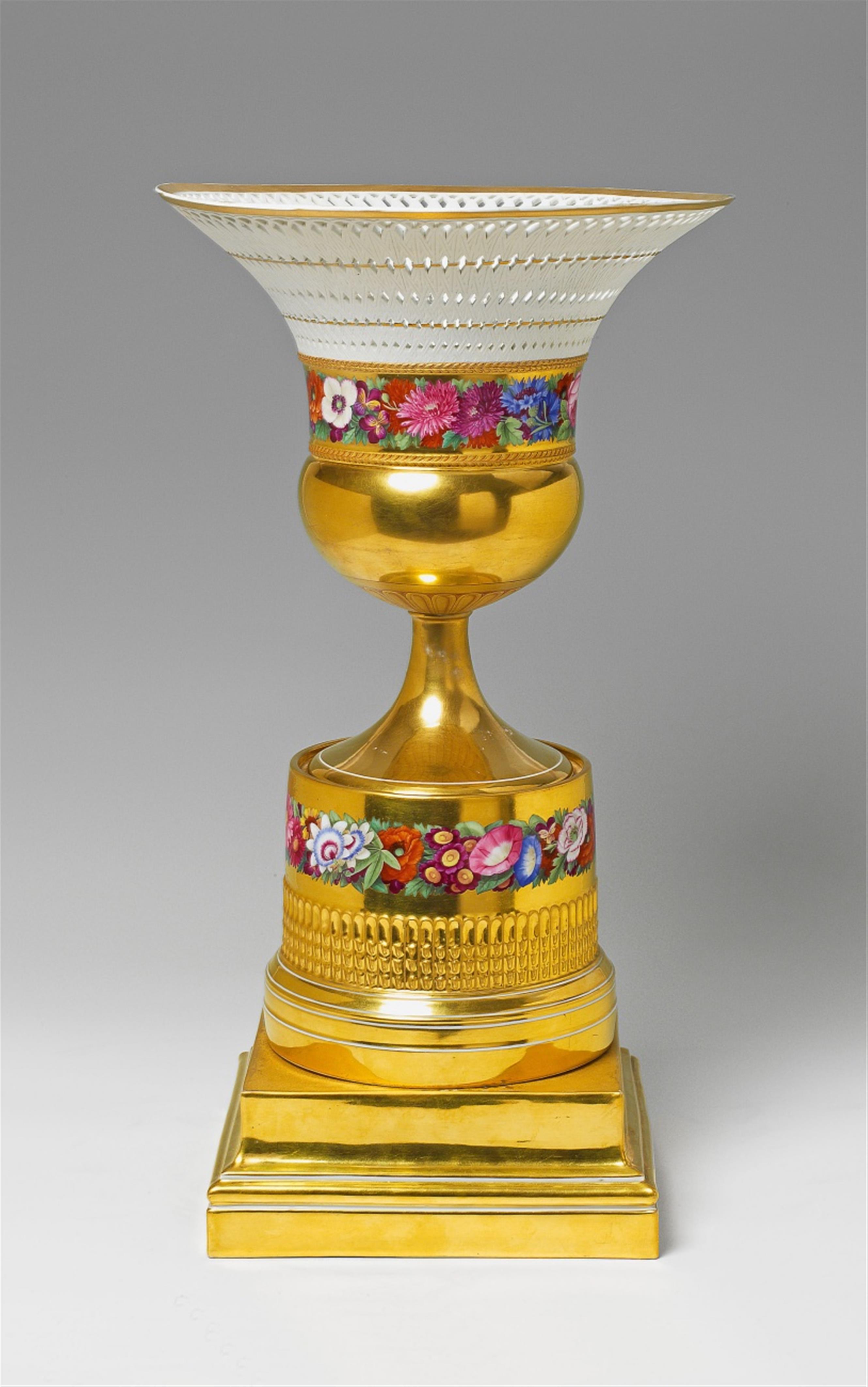 A large Berlin KPM porcelain fruit bowl with floral and gilt decor. - image-1