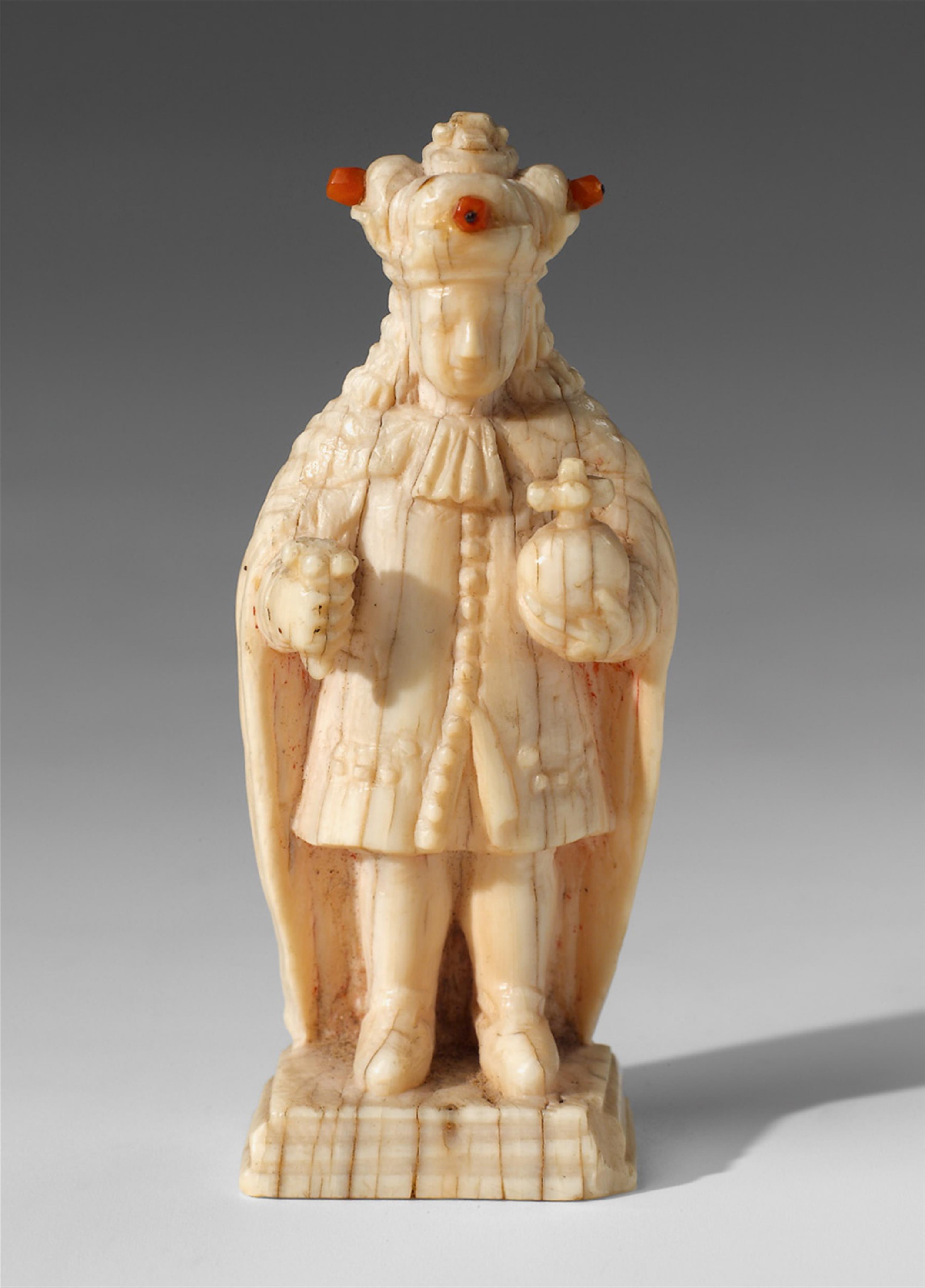An ivory and red coral king chess piece. - image-1