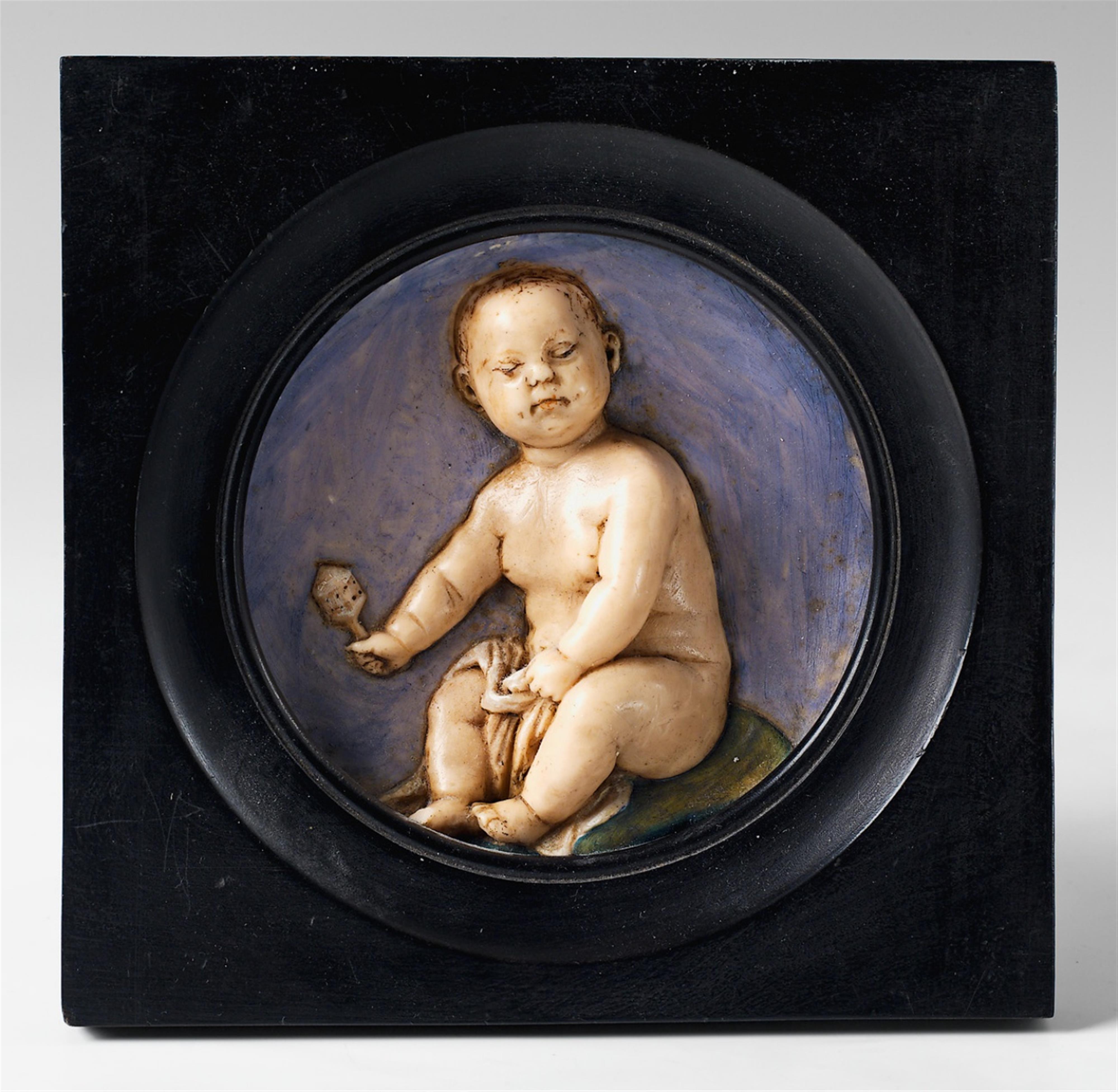 A painted wax relief portrait of a child in an ebonised wood frame. - image-1