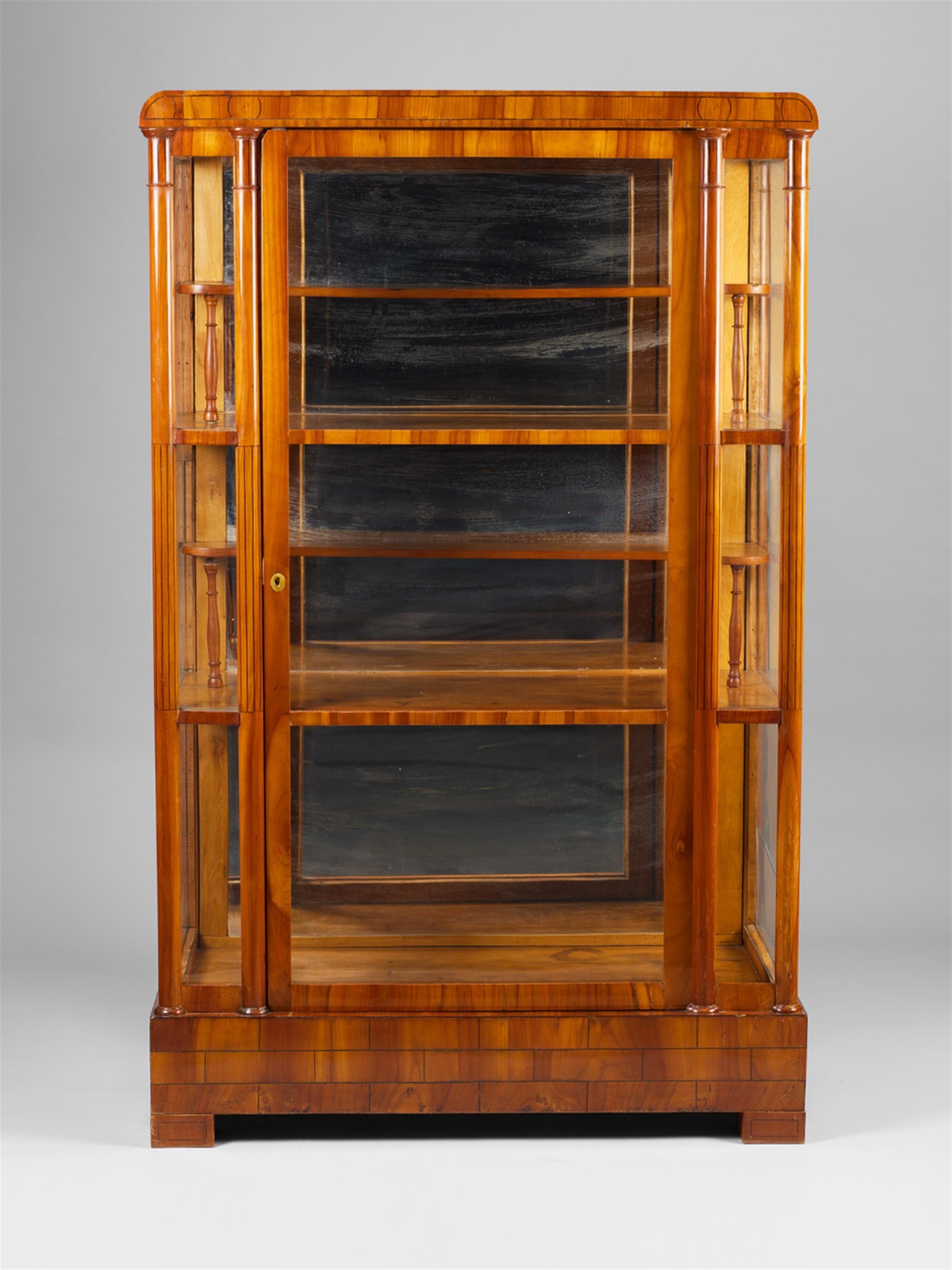 A Vienna Biedermeier cherrywood display cabinet with ebony inlays. - image-1