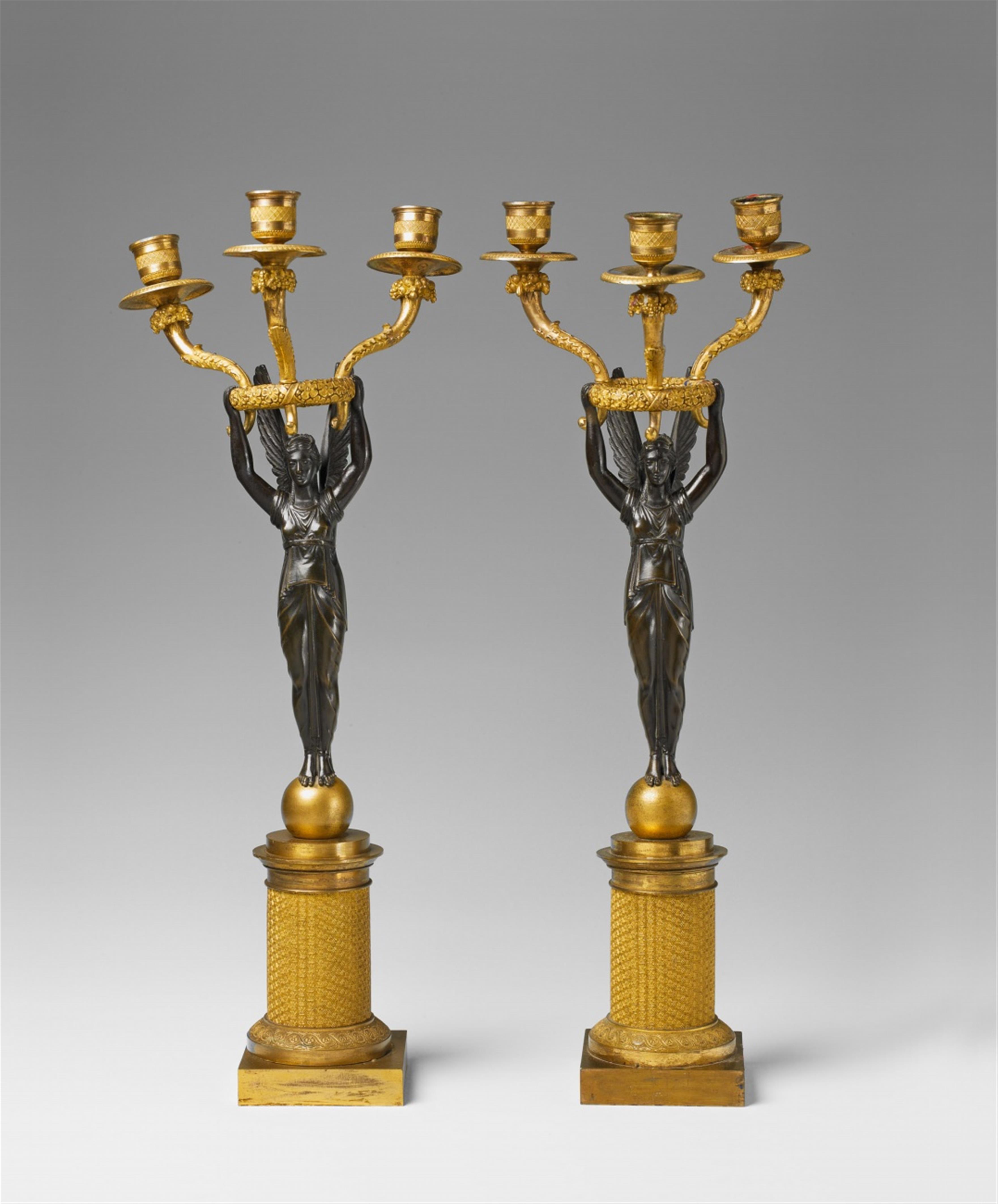 A pair of Parisian ormolu candelabra modelled as allegories of victory. - image-1