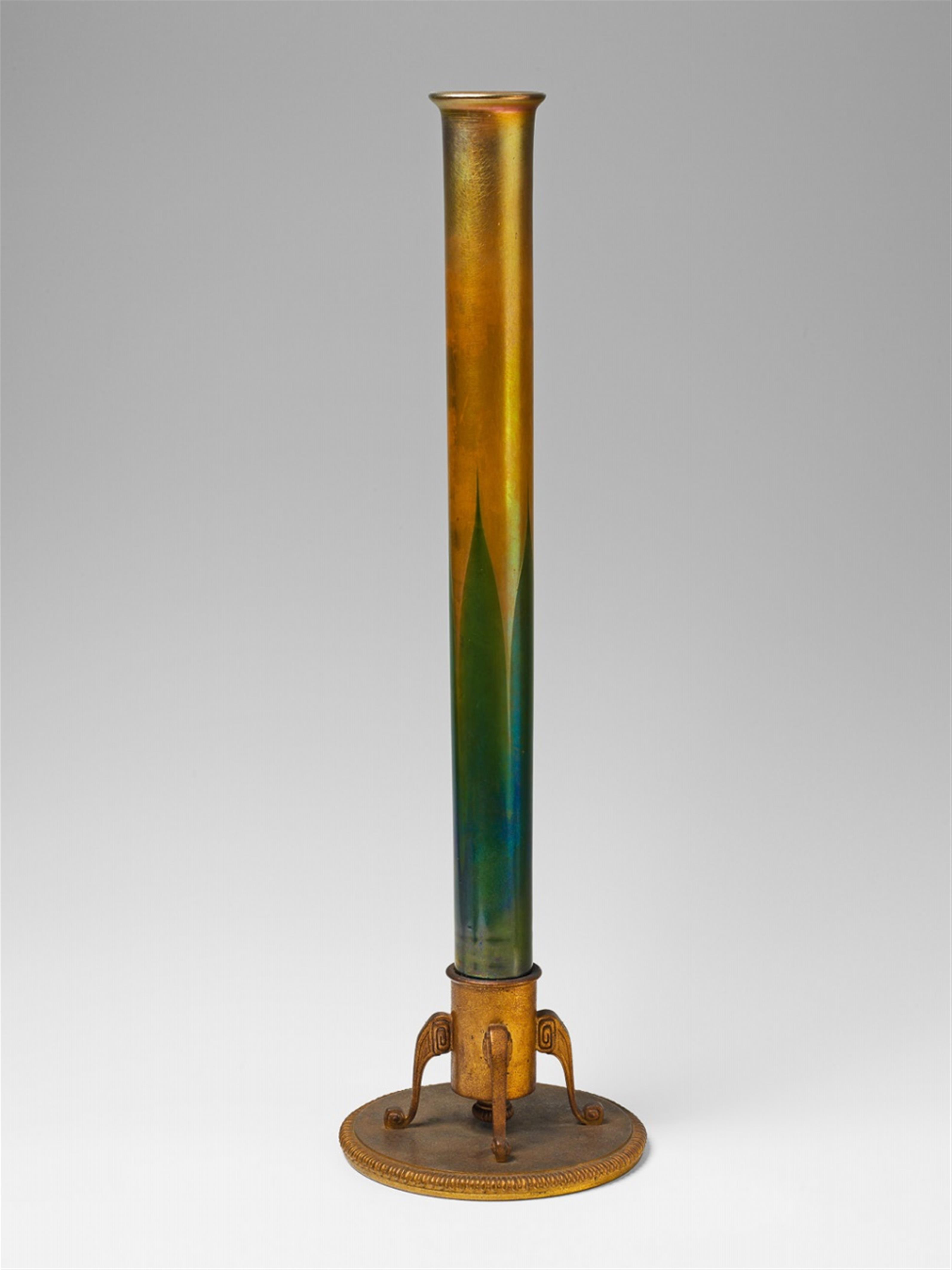 A tall, golden favrile glass vase with green overlay. - image-1