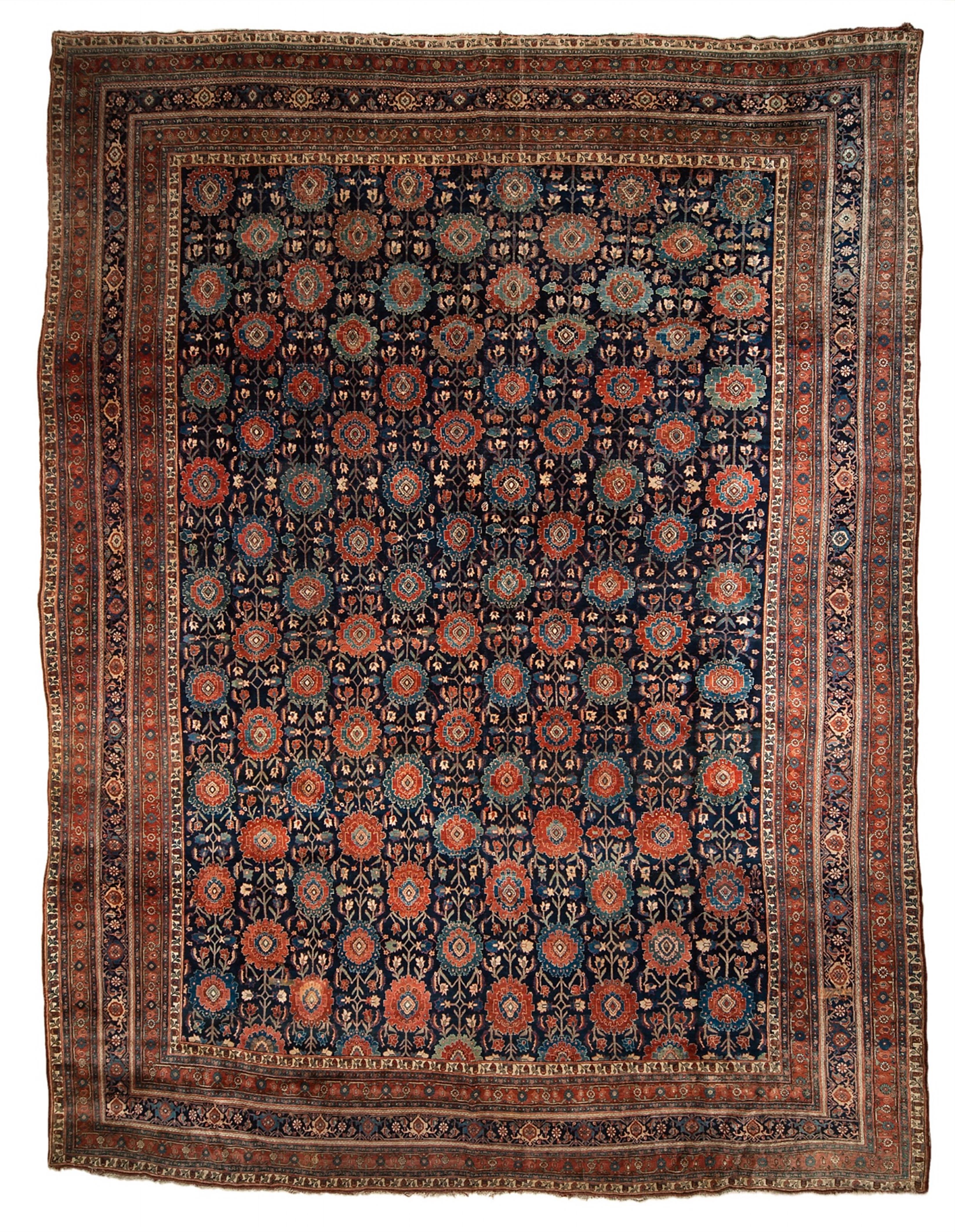 A large Iranian woolen bidjar carpet with stylised floral decor. - image-1