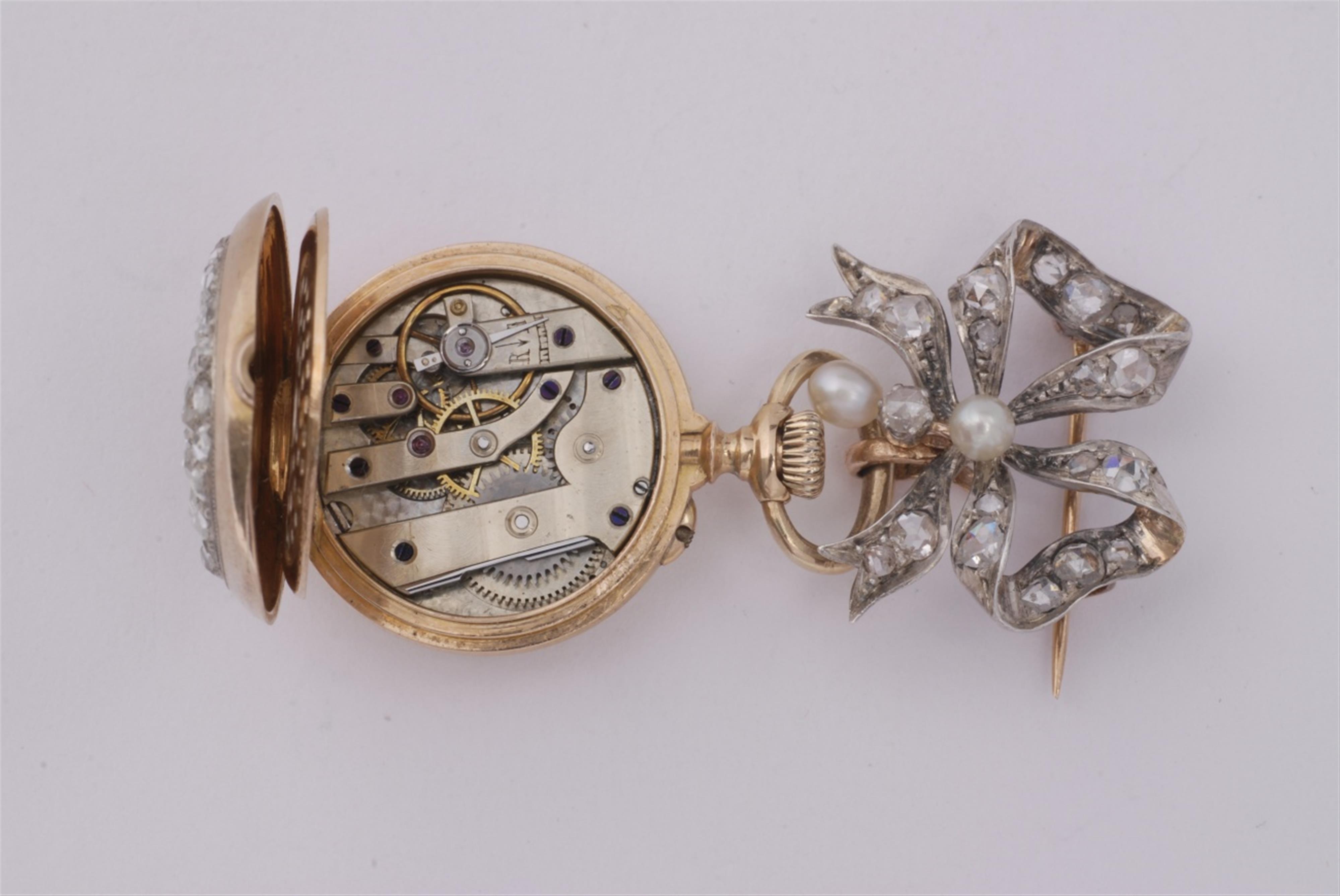 An 18k rose gold and silver brooch with a pendant watch. - image-3