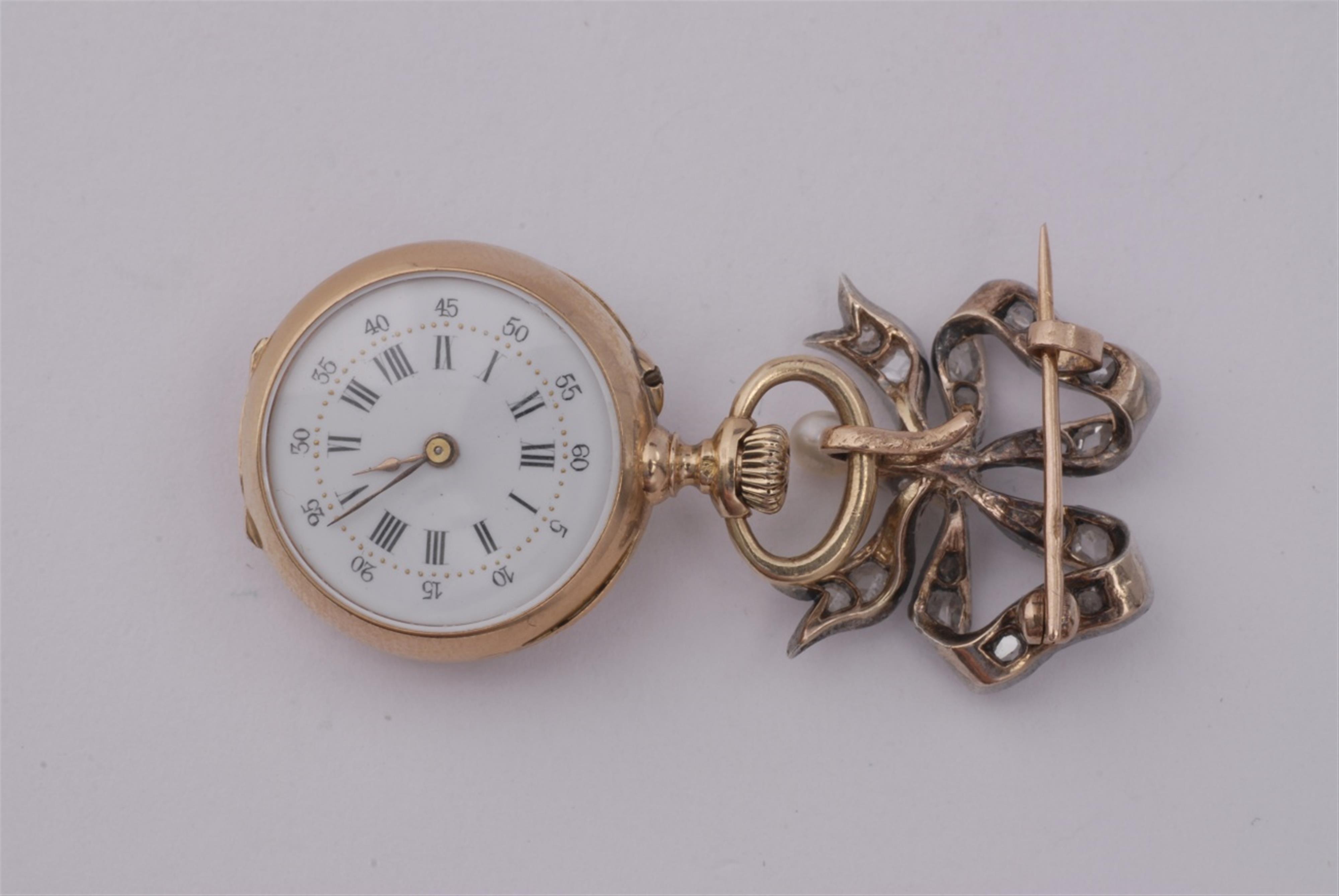 An 18k rose gold and silver brooch with a pendant watch. - image-1