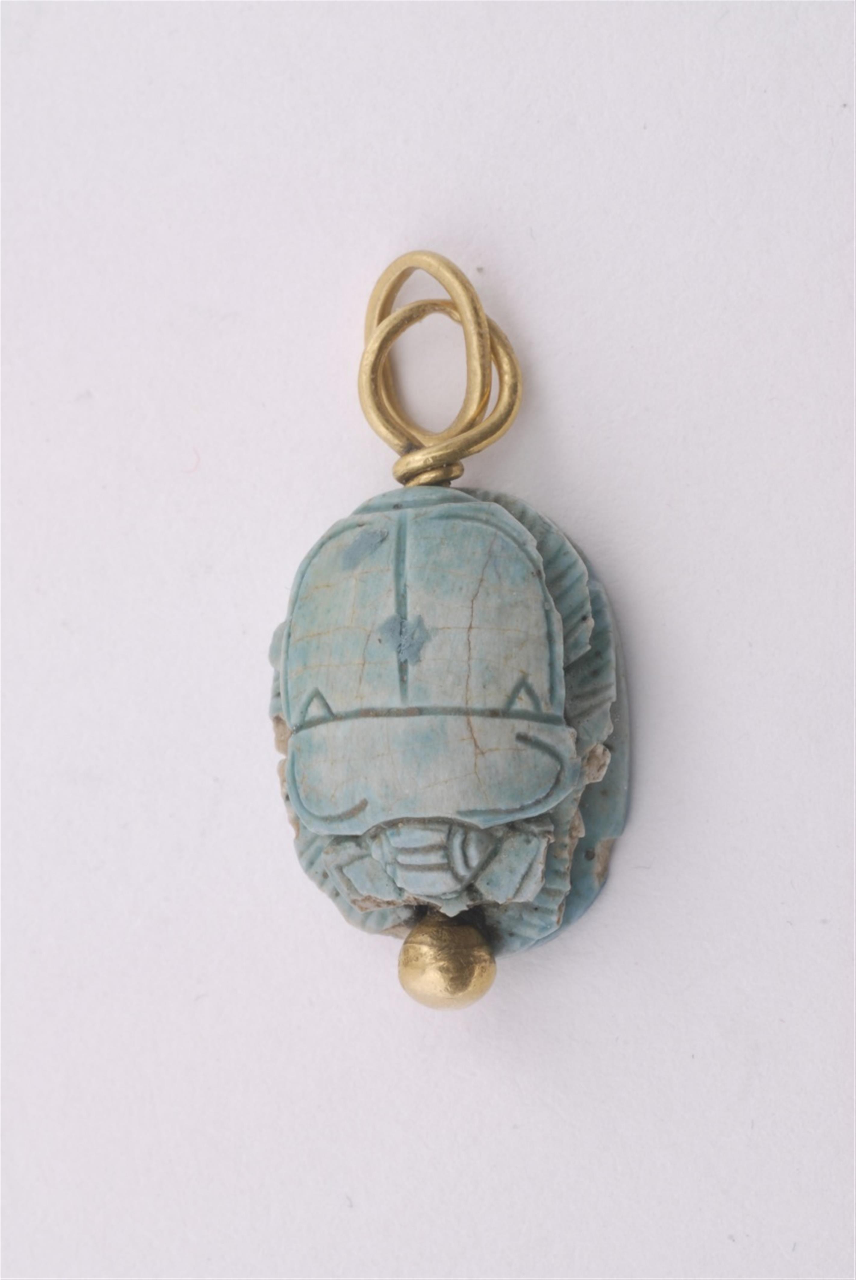 A gold pendant with an ancient faience scarab. - image-2