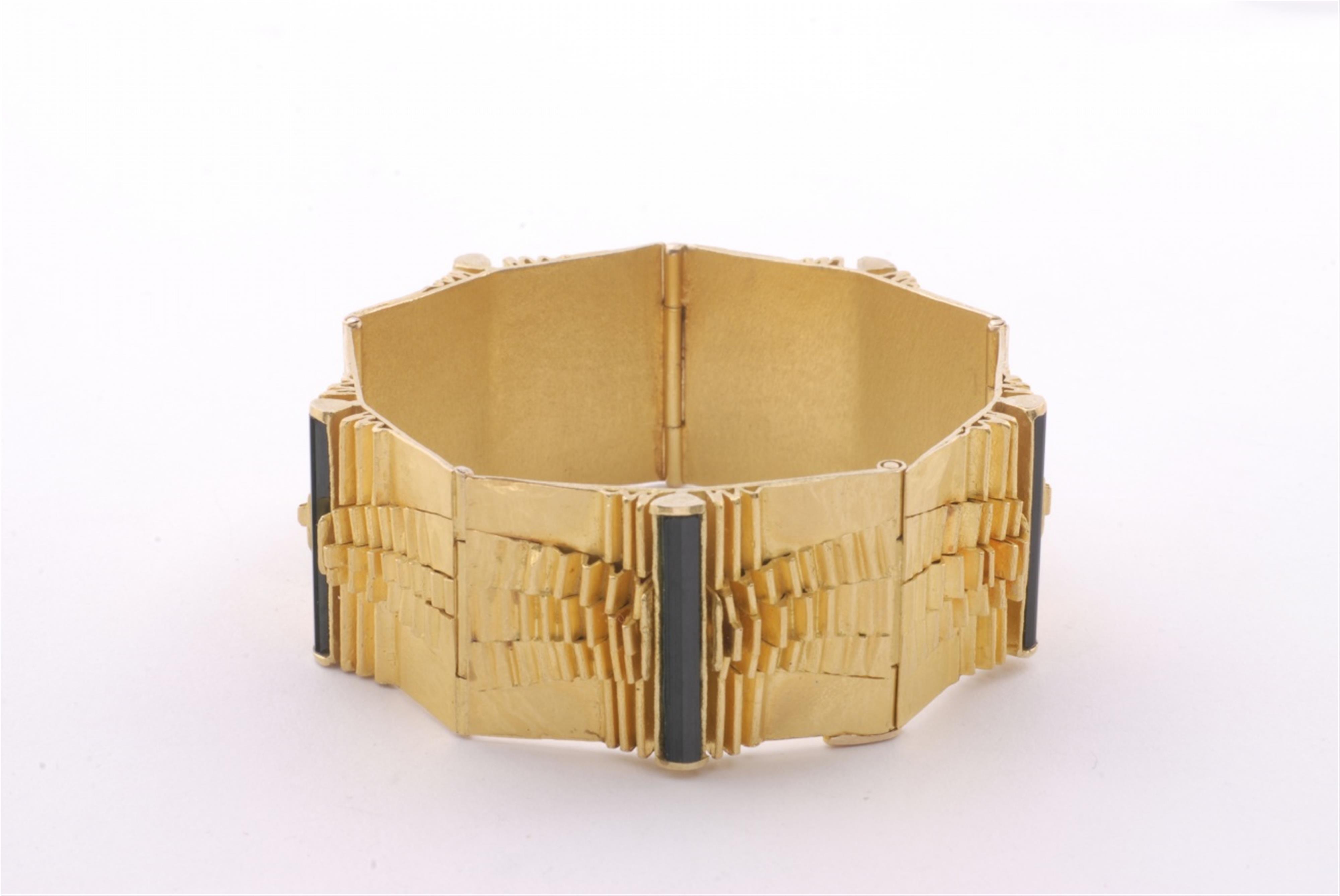 An 18k gold and tourmaline bracelet. - image-1