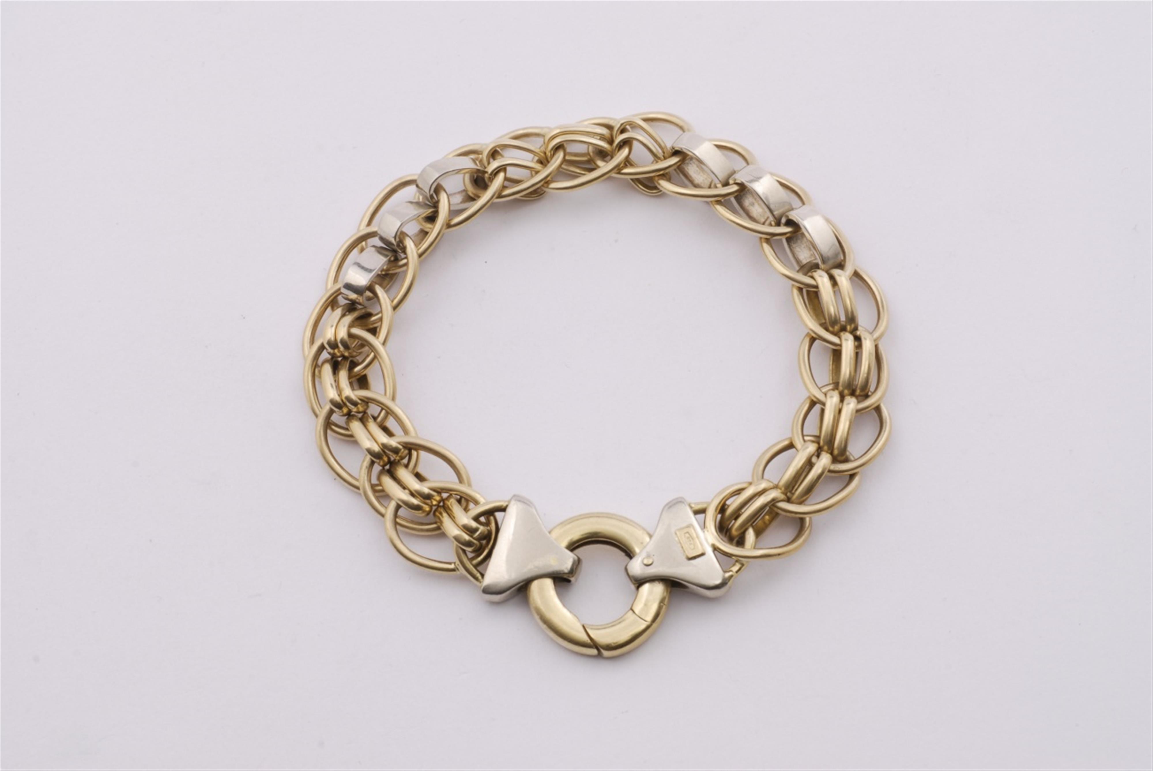 An 18k white and yellow gold bracelet. - image-1