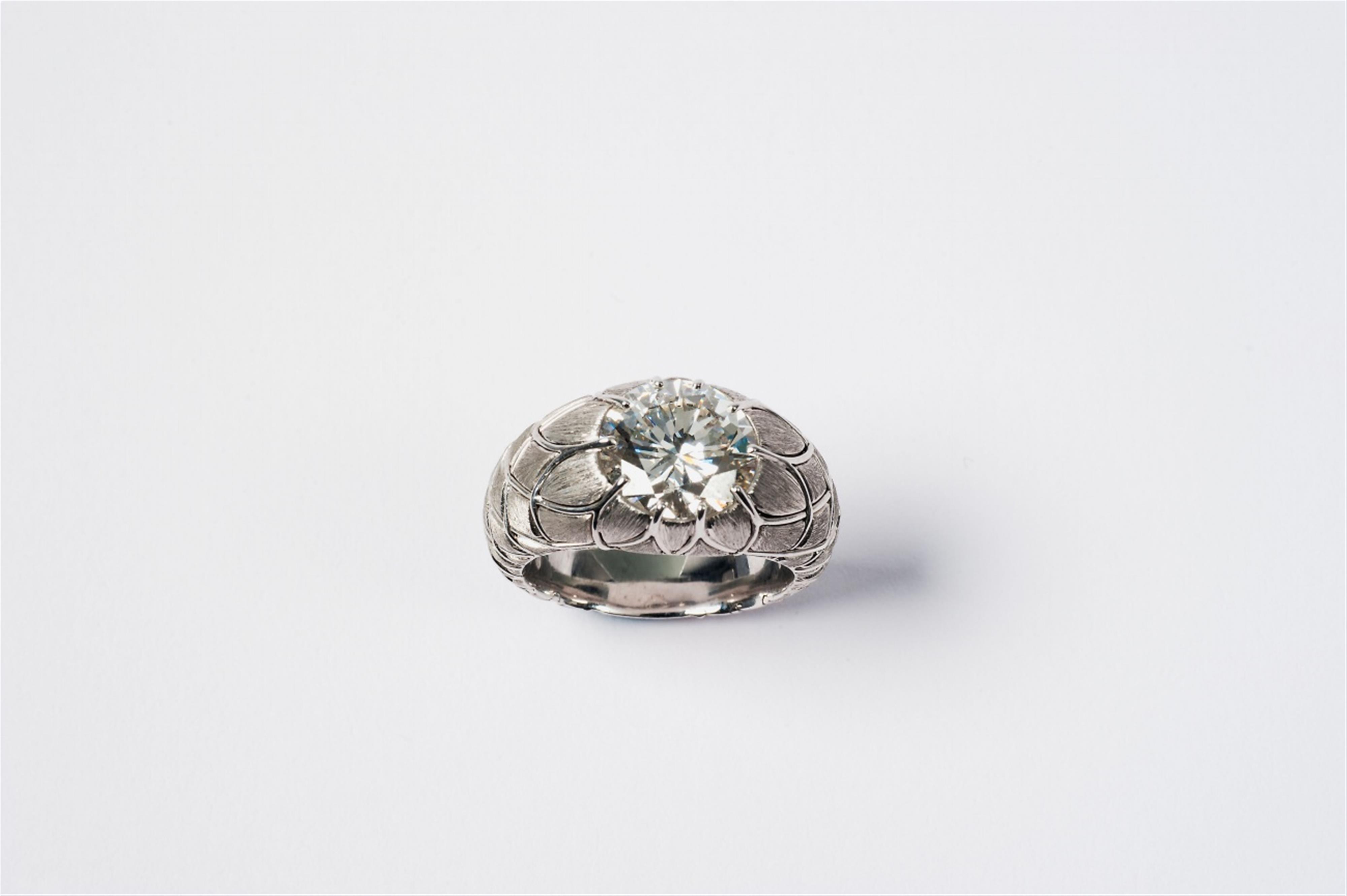 An 18k white gold diamond solitaire ring. - image-2