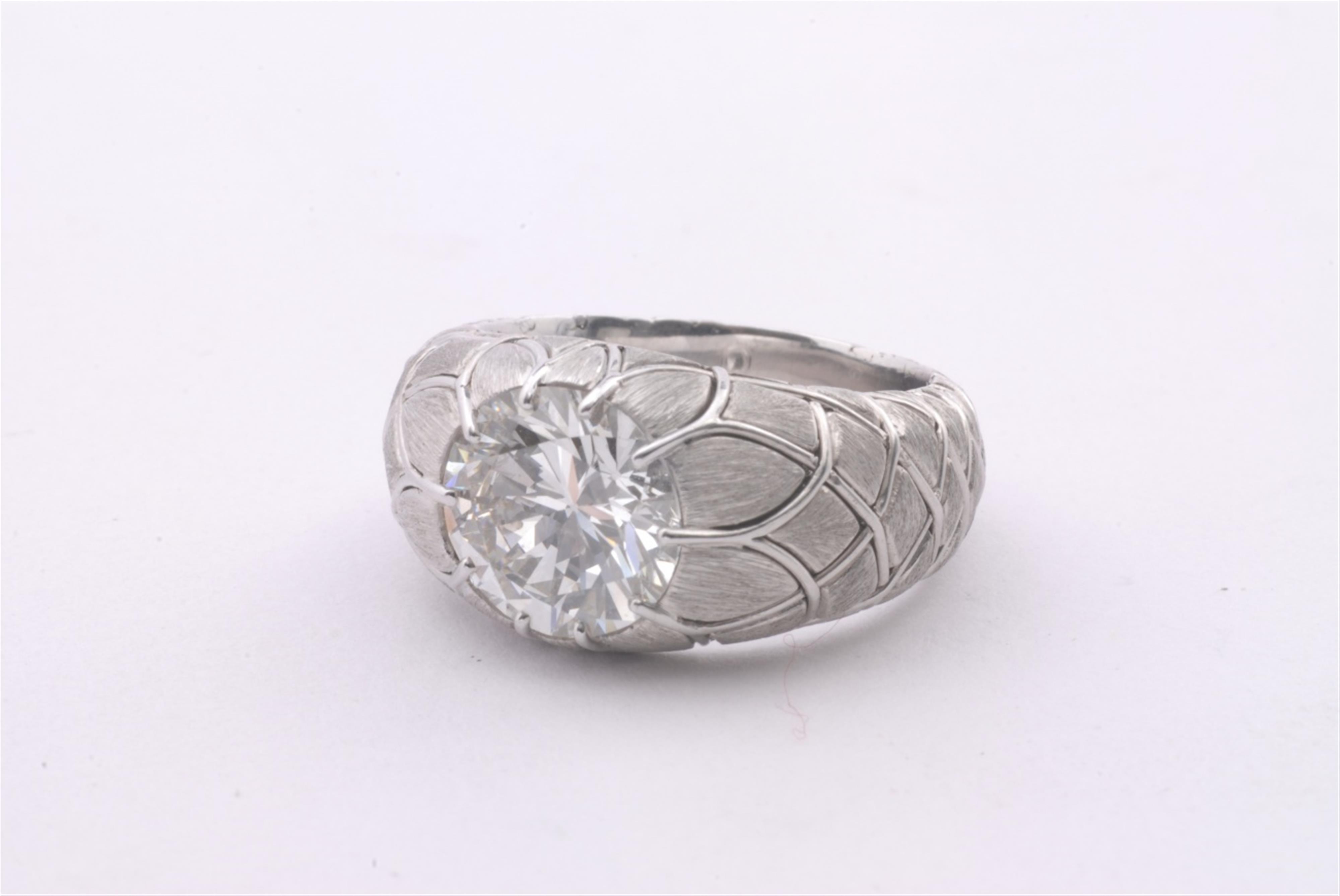 An 18k white gold diamond solitaire ring. - image-3