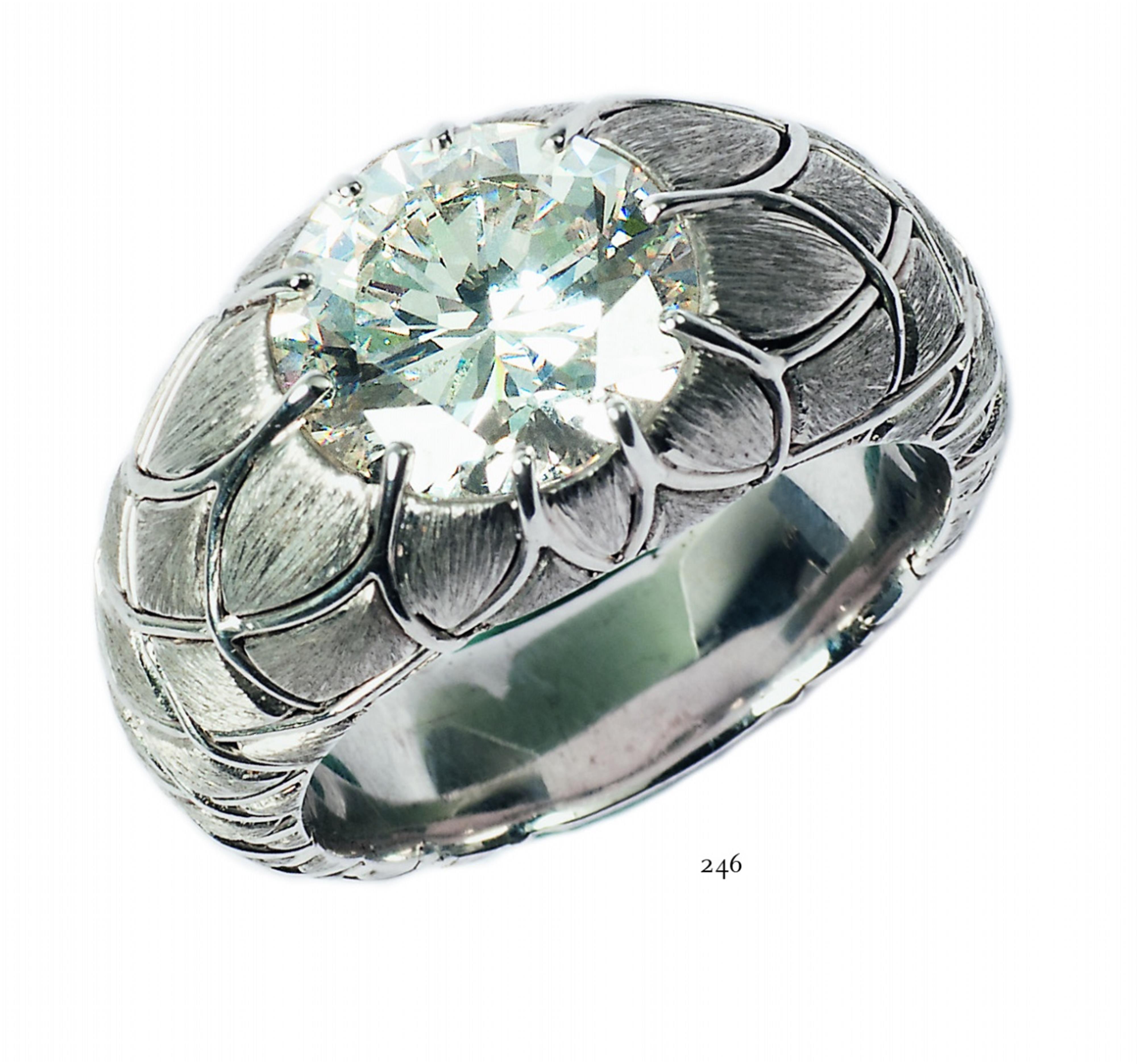 An 18k white gold diamond solitaire ring. - image-4