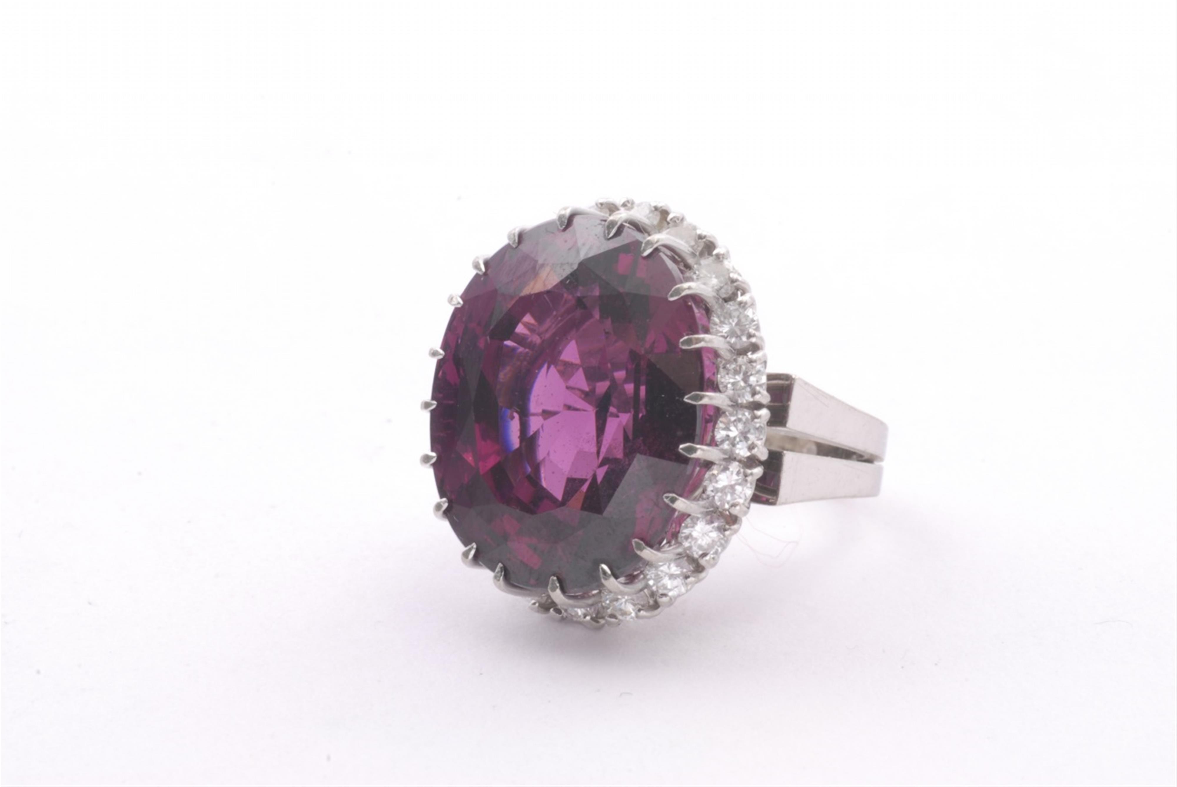 An 18k white gold and almandine ring. - image-1