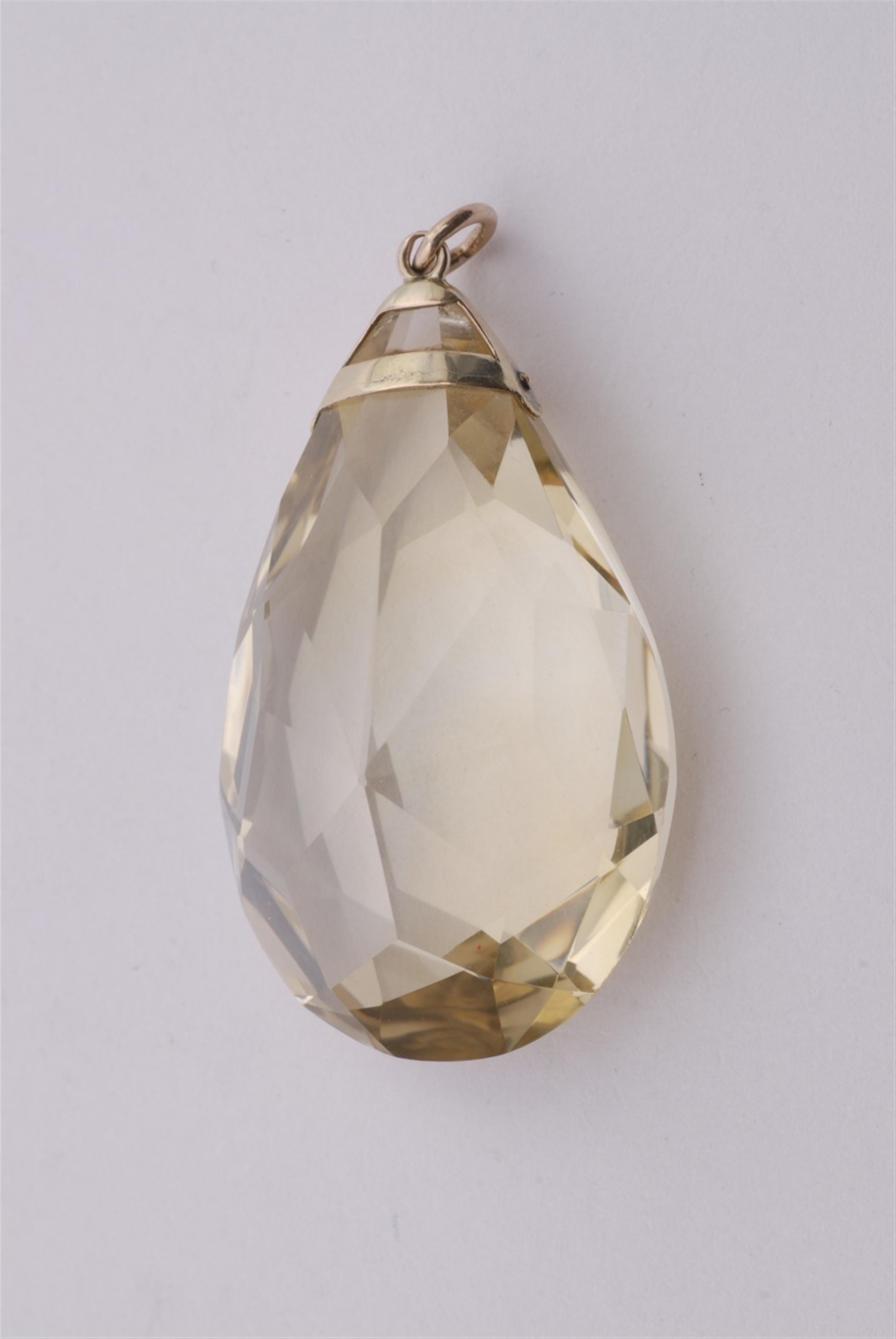 A 9k gold and citrine pendant. - image-1