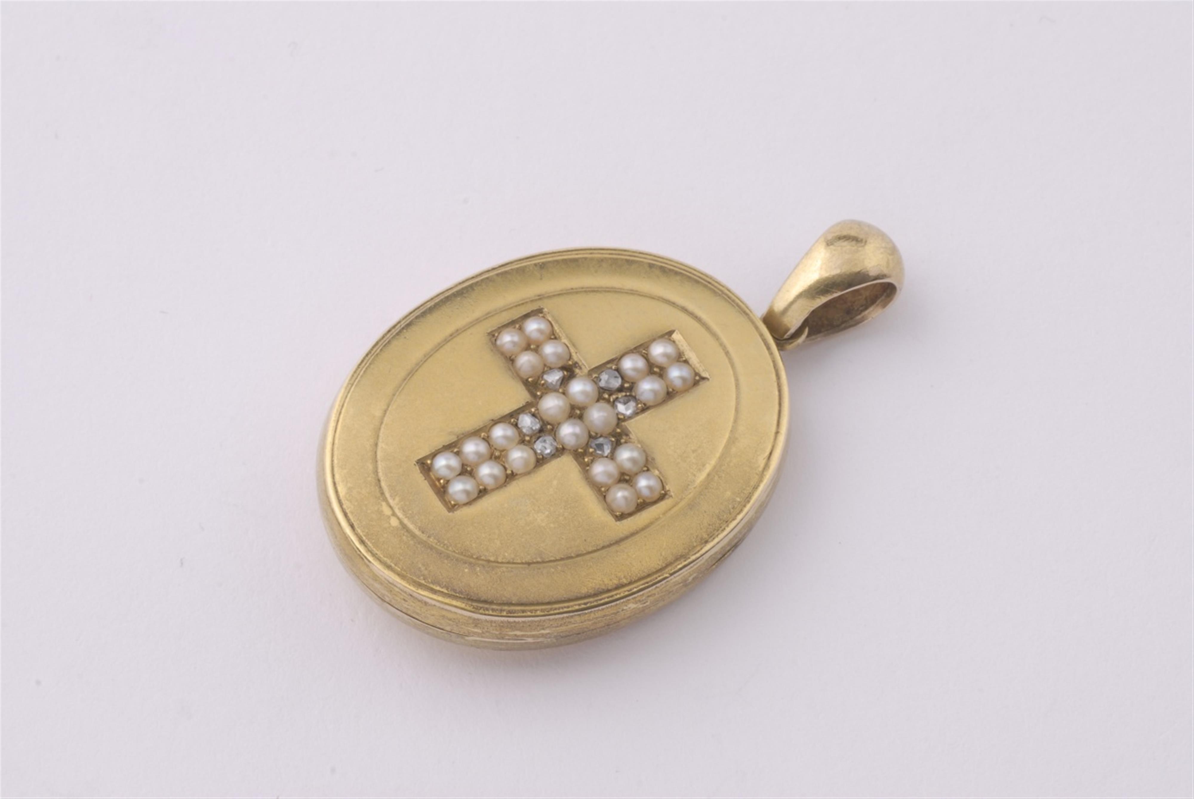 An 18k gold cross medallion pendant. - image-1