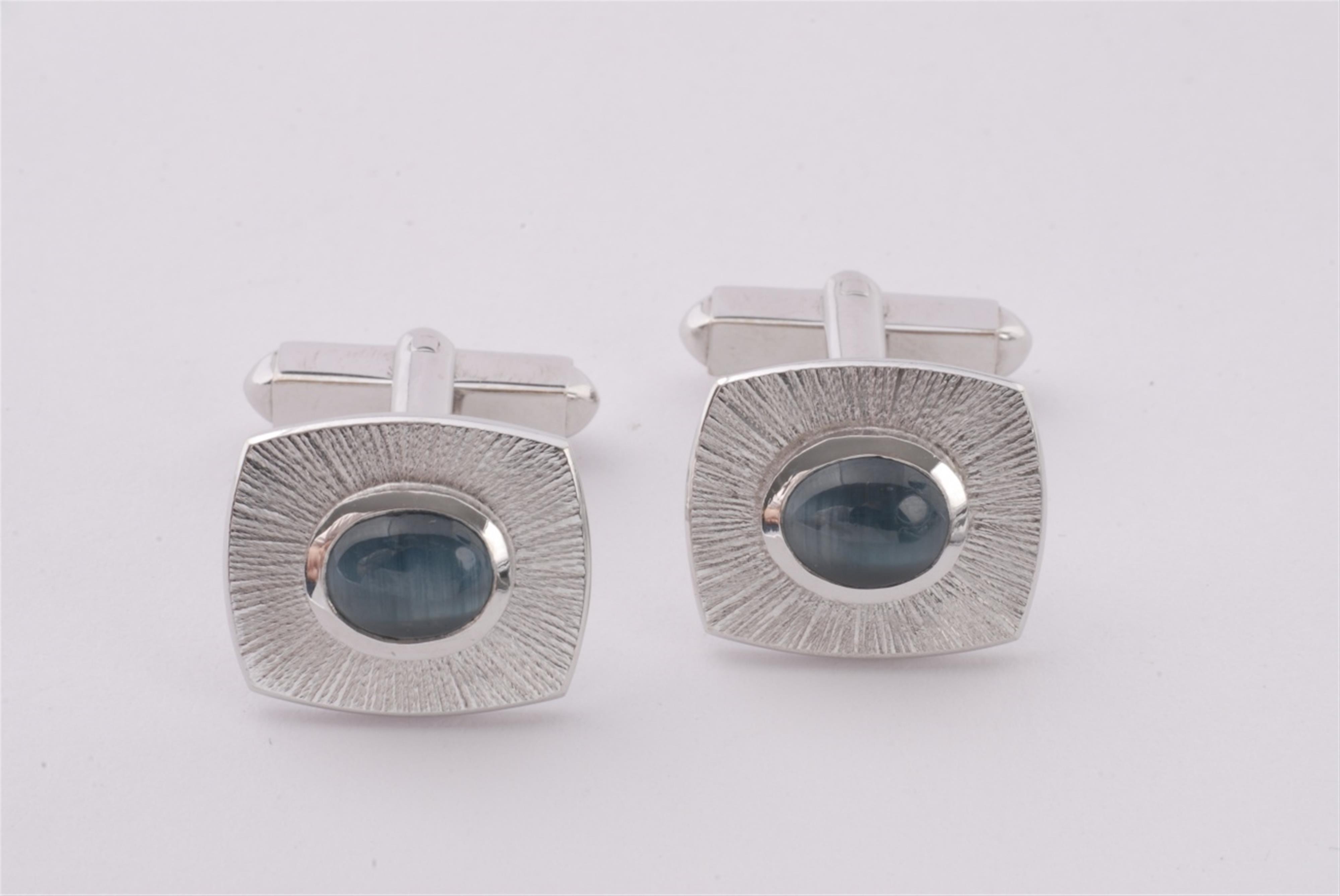 A pair of 18k white gold and indigolith cat's eye cufflinks. - image-1