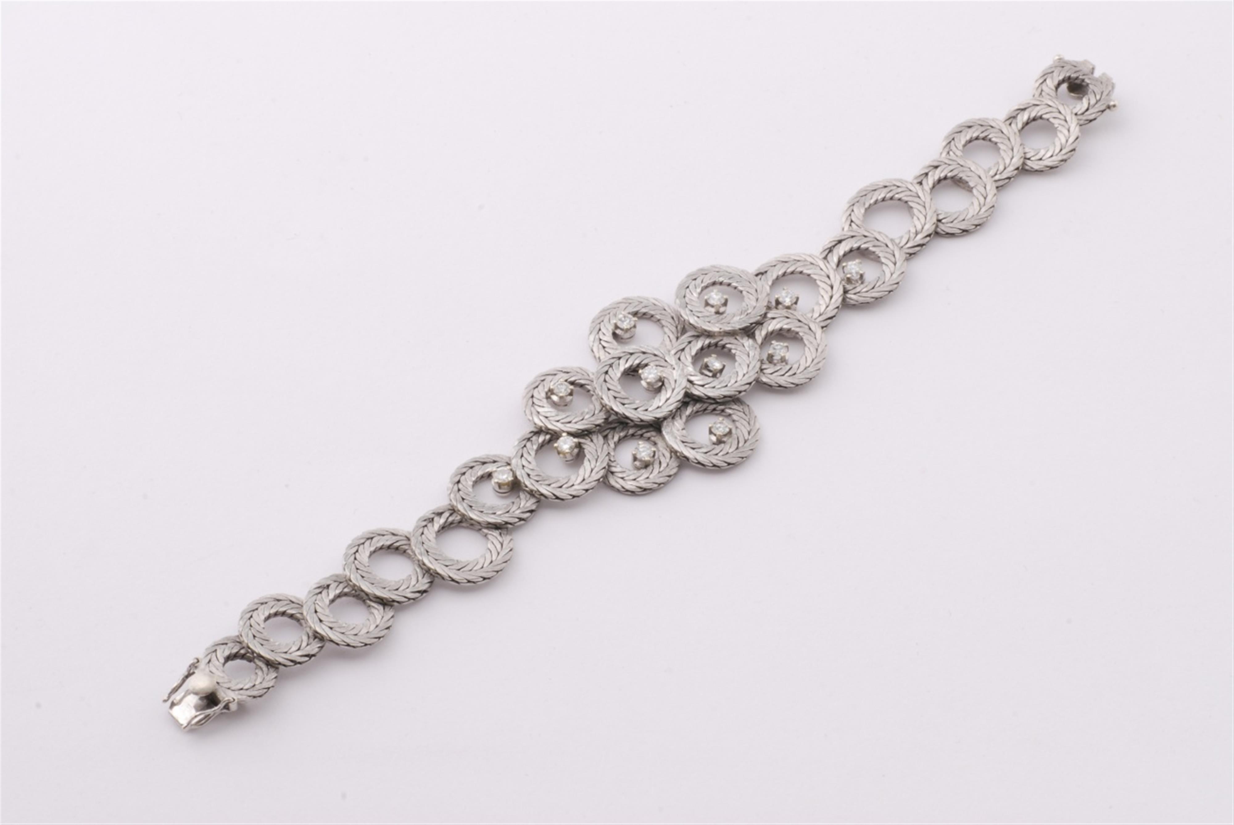 An 18k white gold and diamond bracelet. - image-1