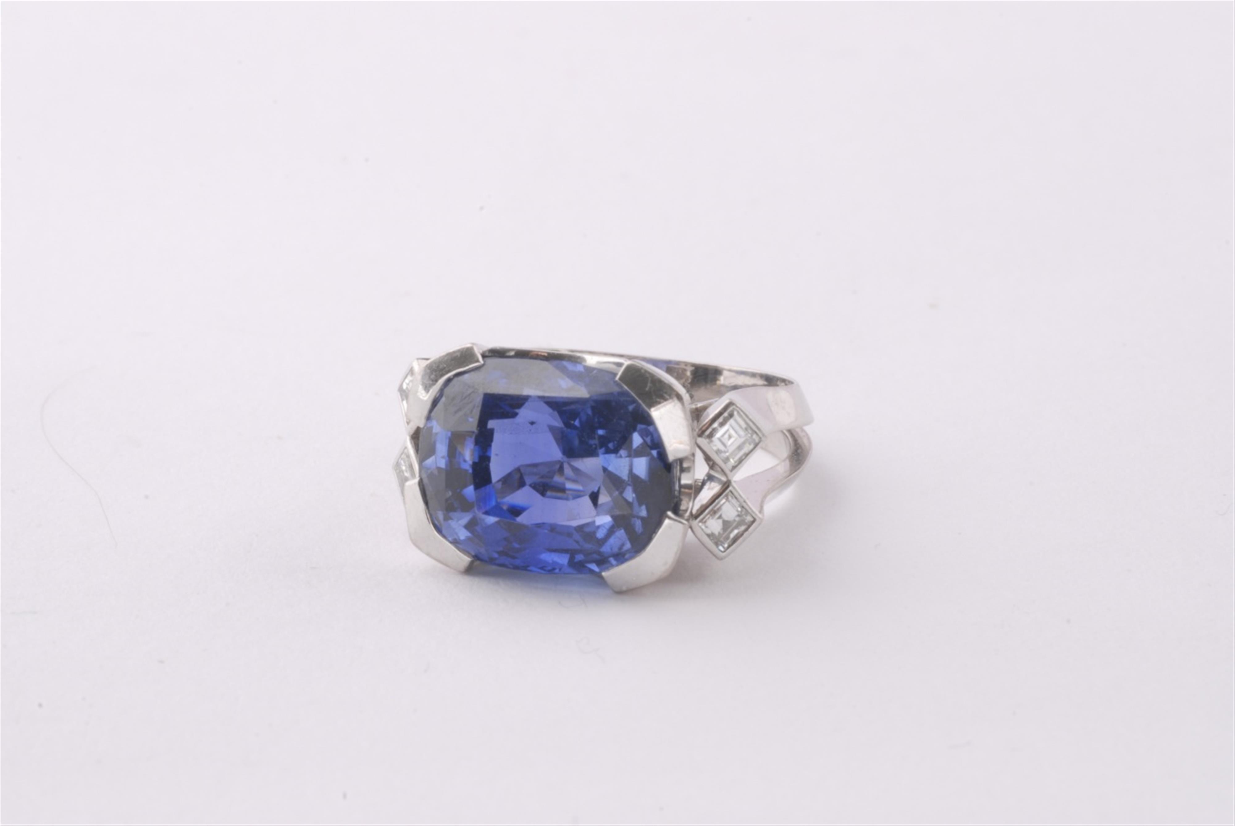 A custom made 18k white gold and sapphire ring. - image-1