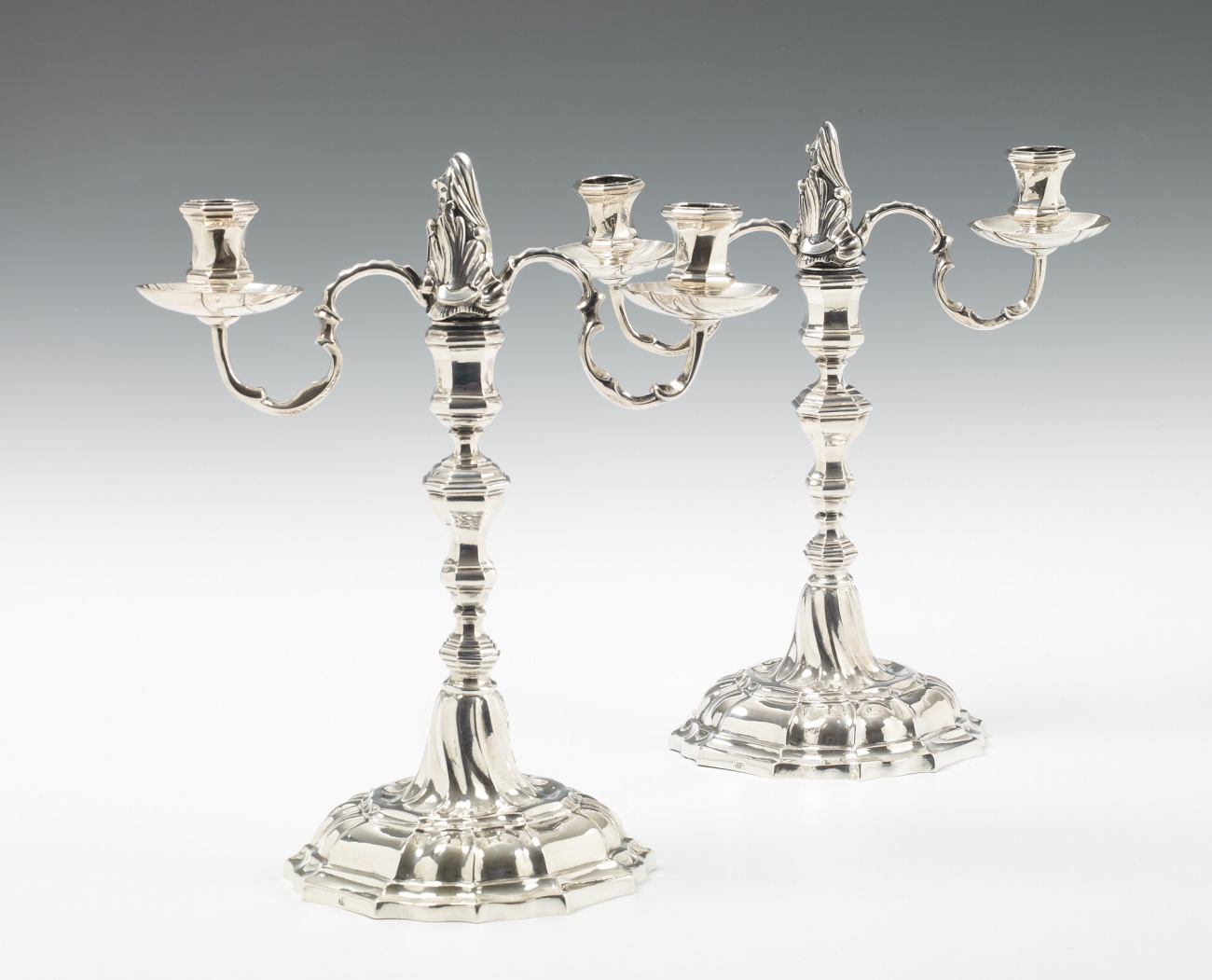 A pair of silver candelabra - image-1