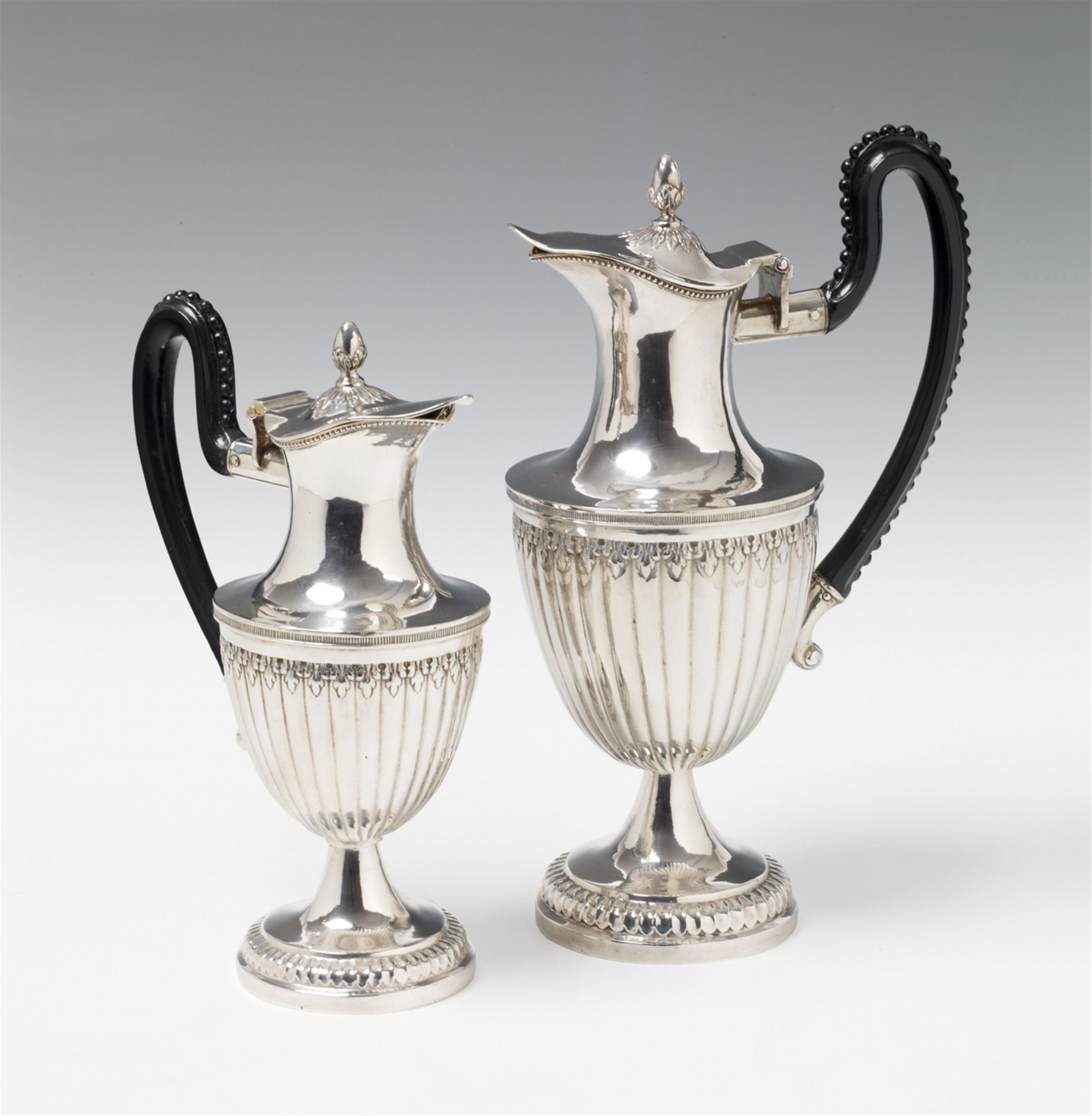 A pair of Neoclassical Augsburg interior gilt silver wine pitchers - image-1