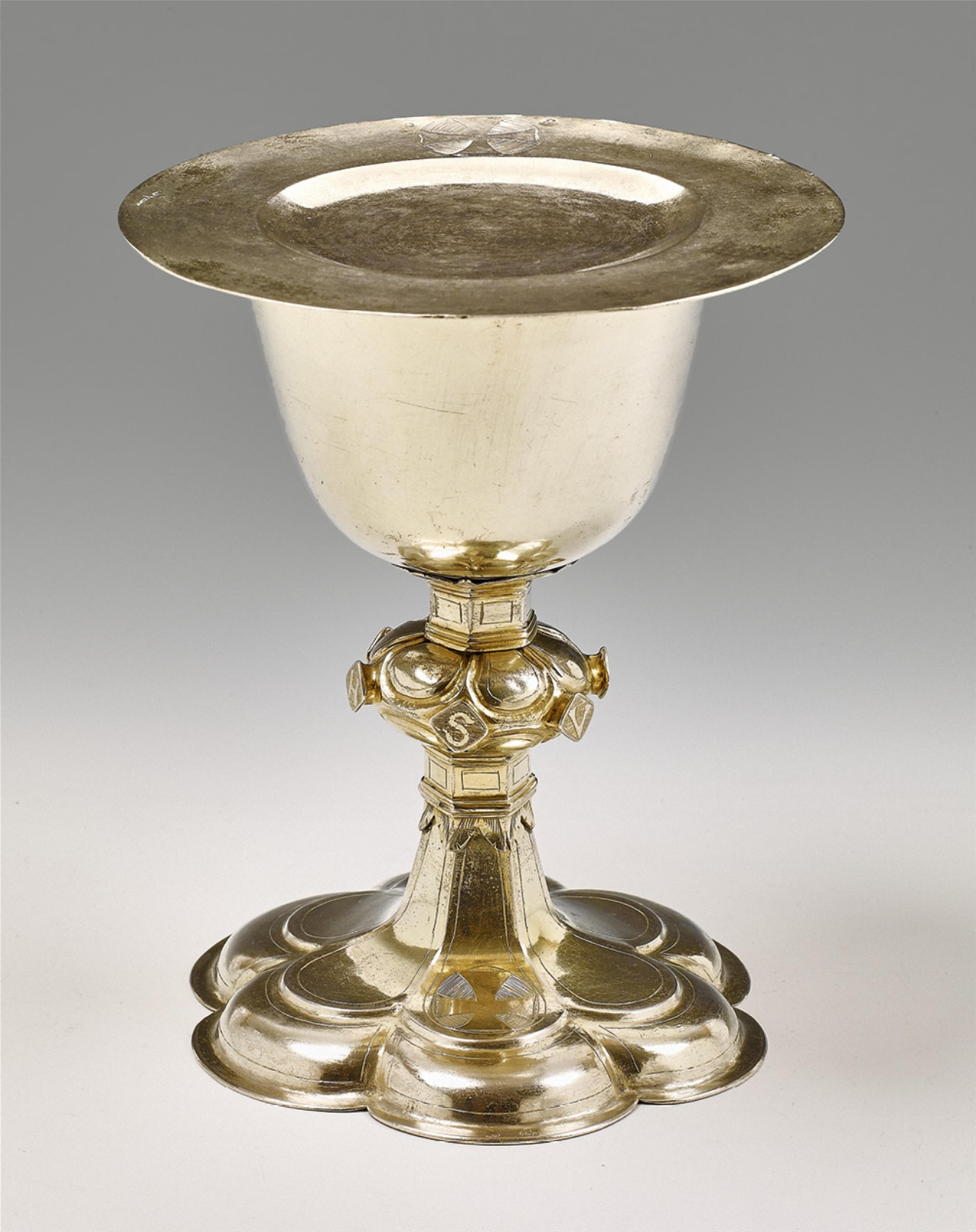 A partially gilt silver communion chalice and paten - image-1