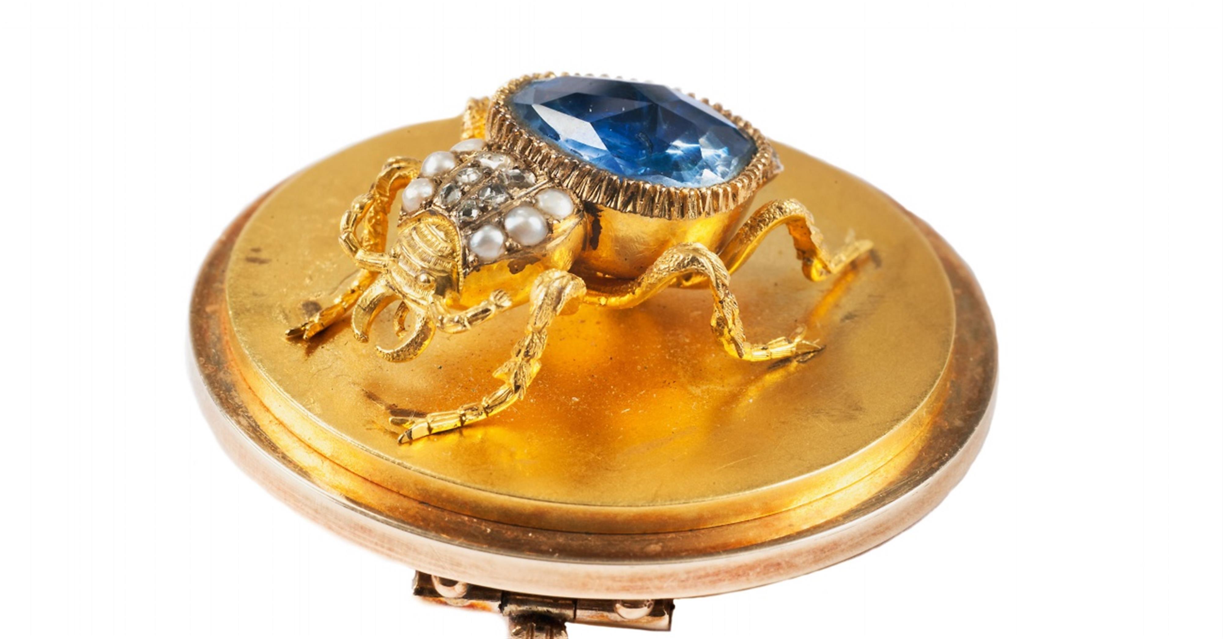 A 14k gold and sapphire brooch. - image-2