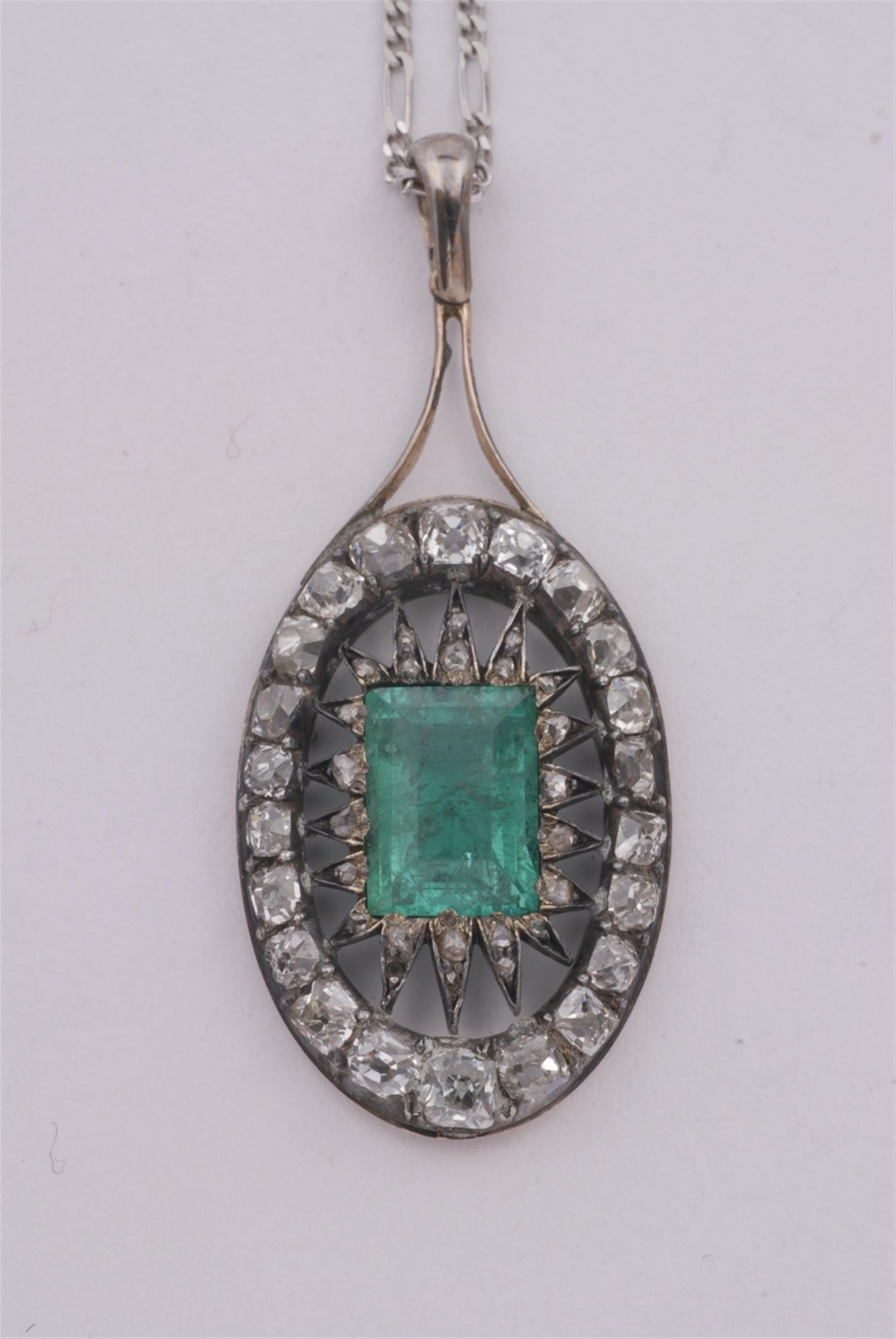 A 14k gold, silver, emerald and diamond pendant. - image-1