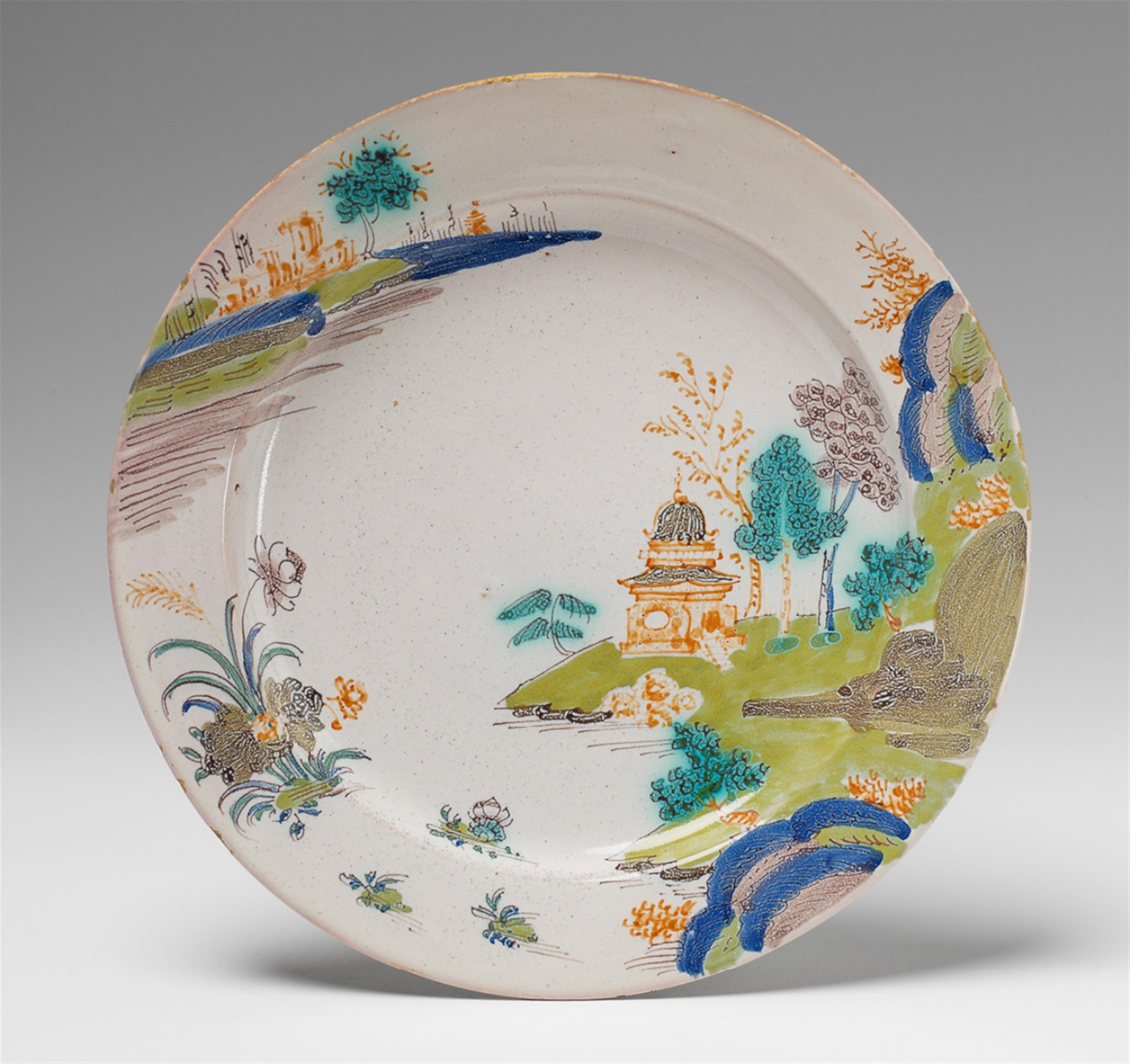 A Faenza faience plate with "grand feu" chinoiserie decor. - image-1