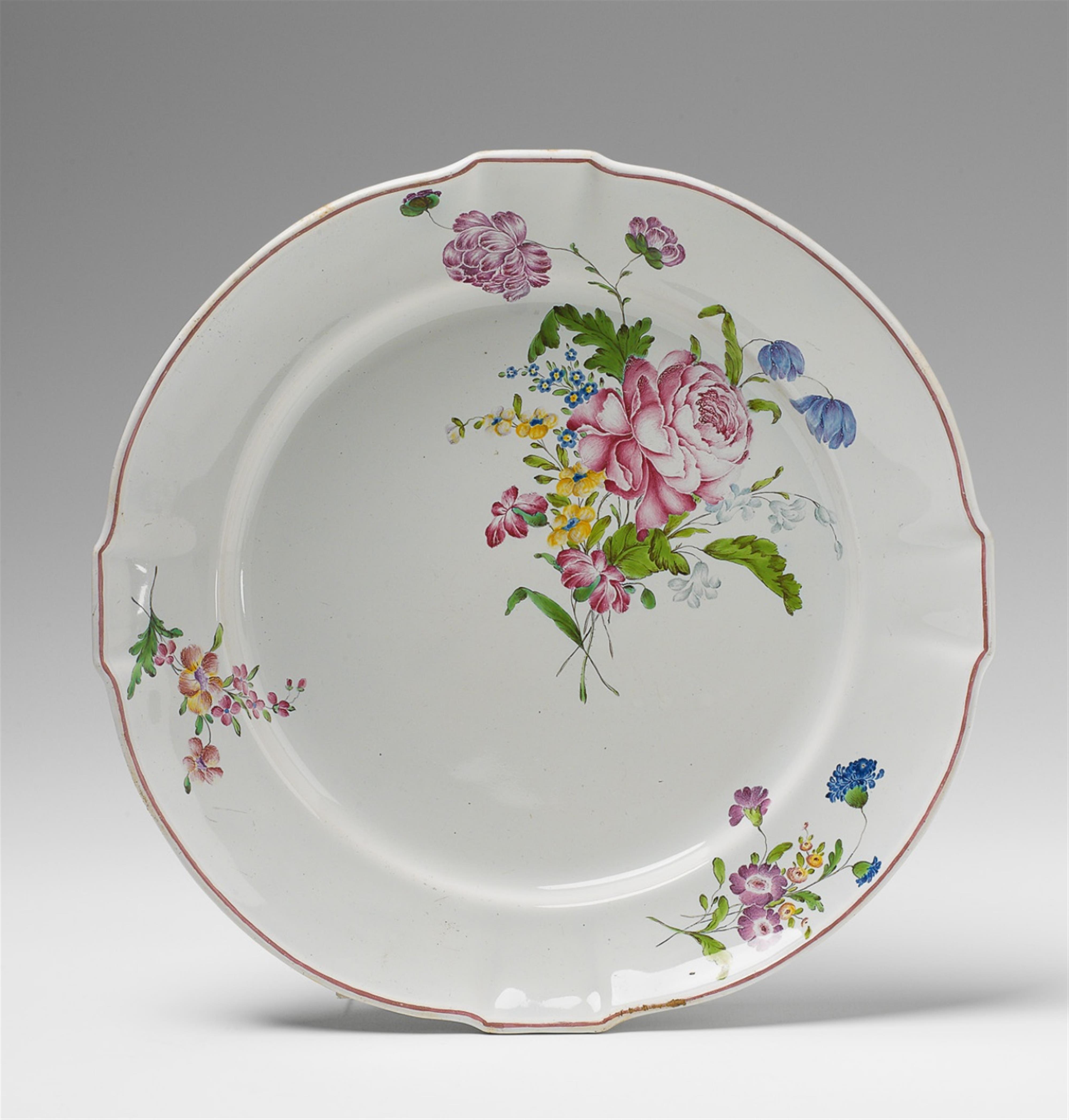 A scalloped faience platter with "fleurs fines" decor. - image-1
