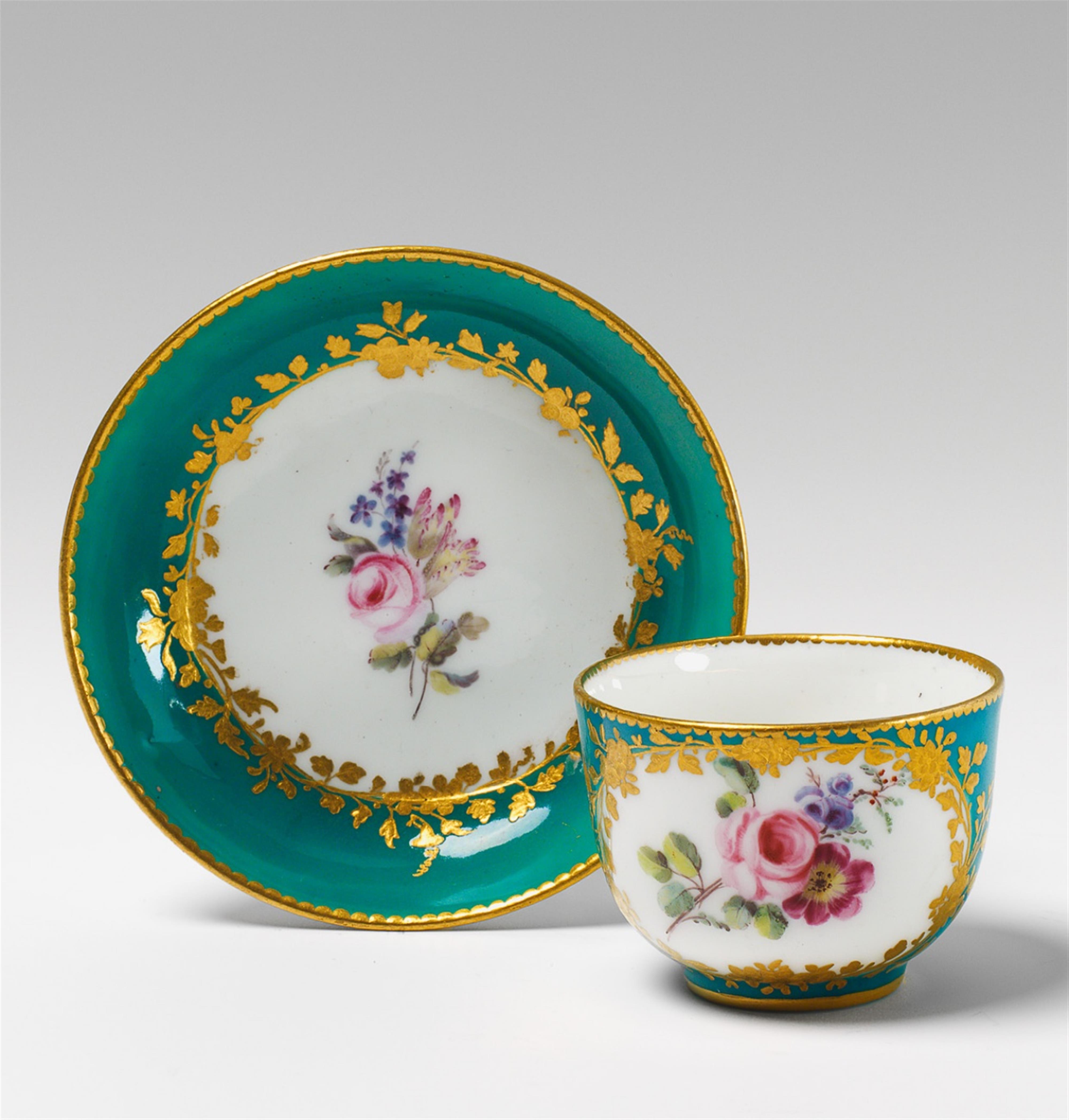 A small Sèvres soft paste porcelain cup and saucer with rose decor. - image-1