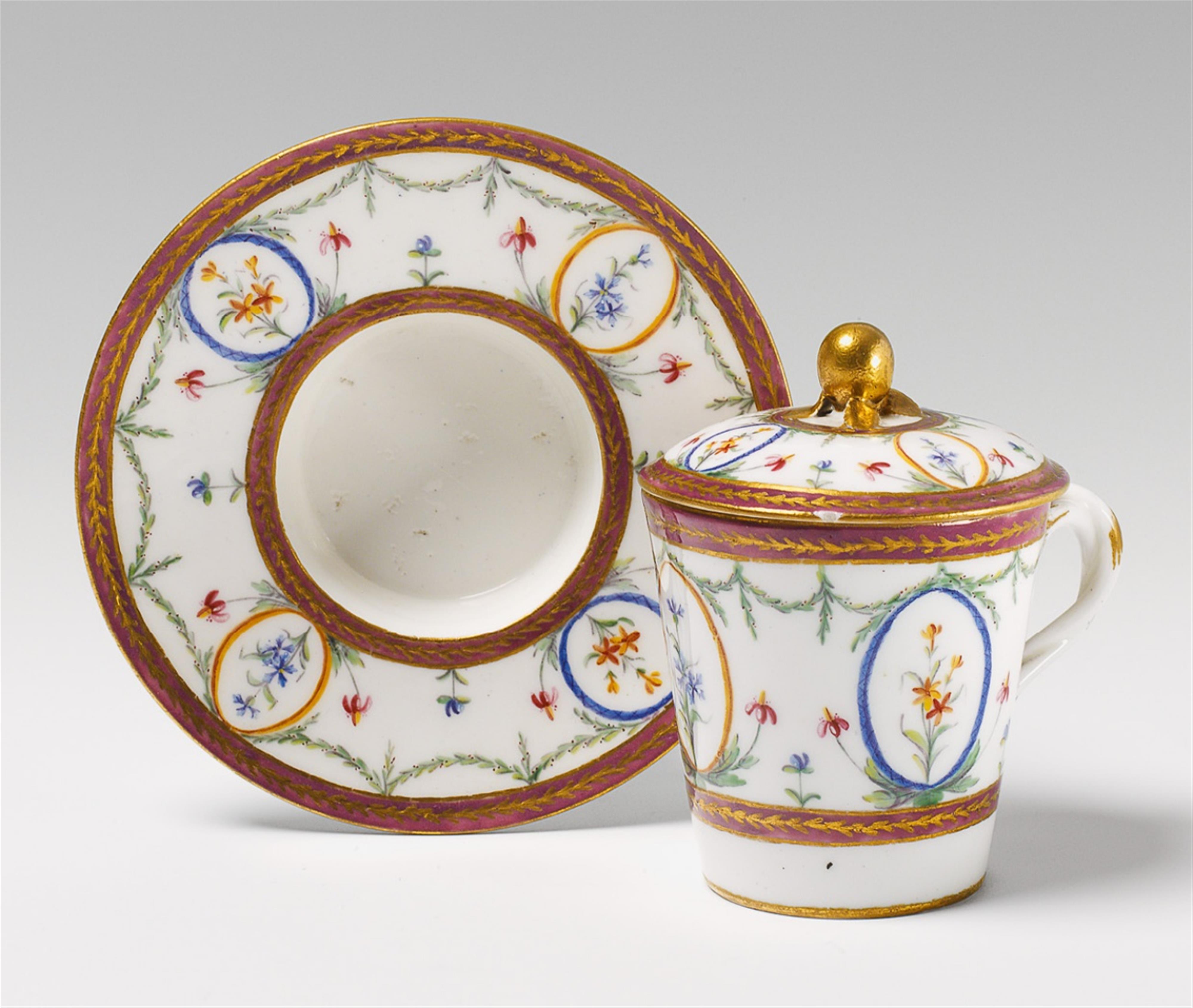 A Sèvres porcelain covered cup and saucer. - image-1