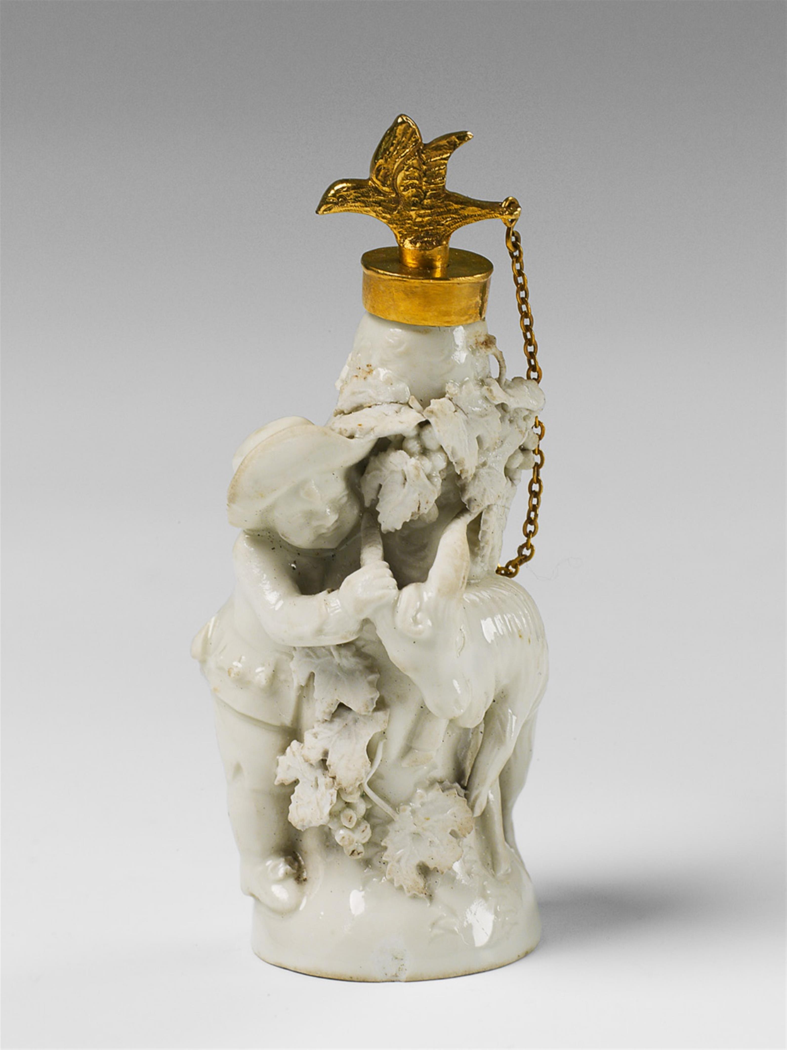 A gilt metal mounted porcelain "Chelsea toy" figural bottle. - image-1
