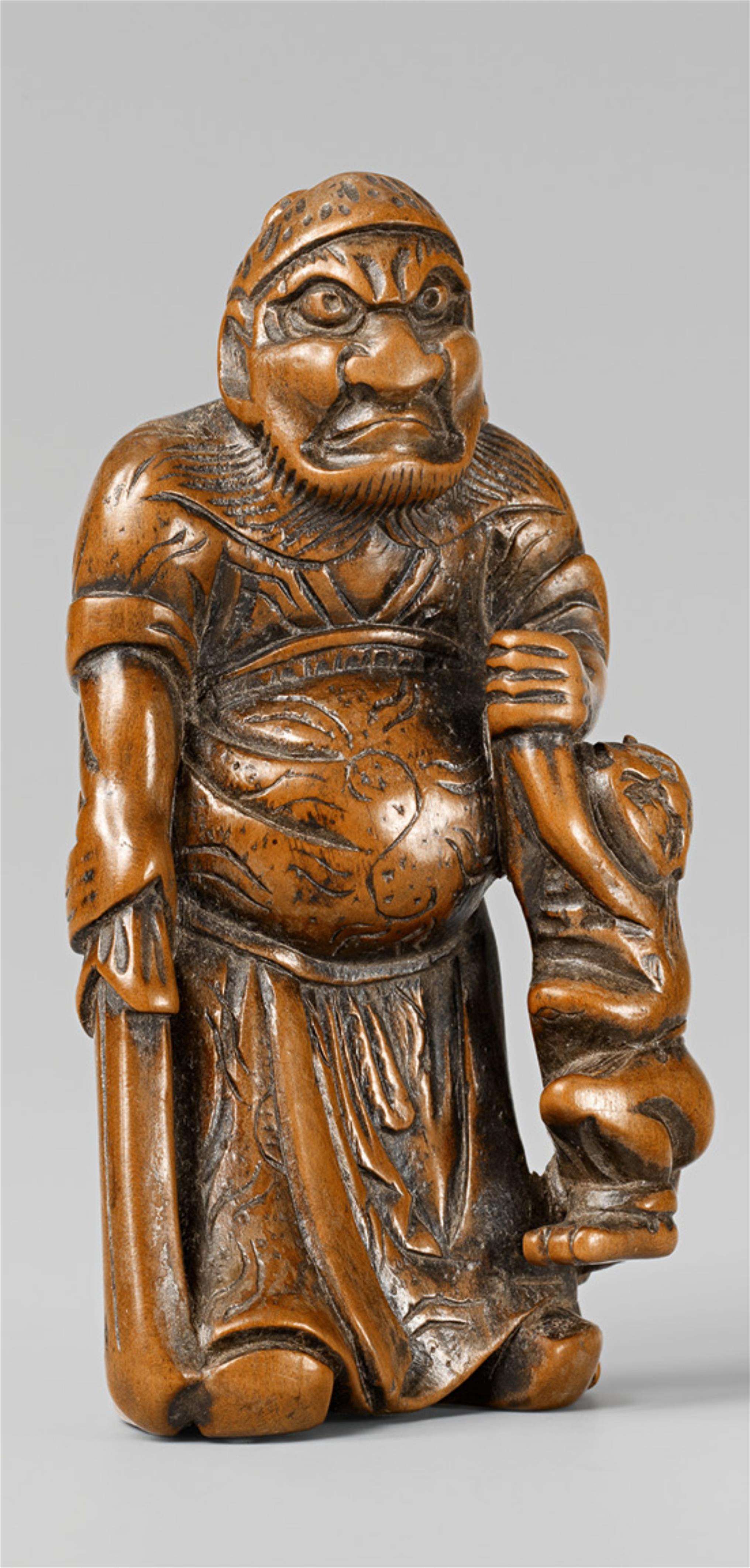 A large boxwood netsuke of a grim-looking Shôki with an oni. Early 19th century - image-1