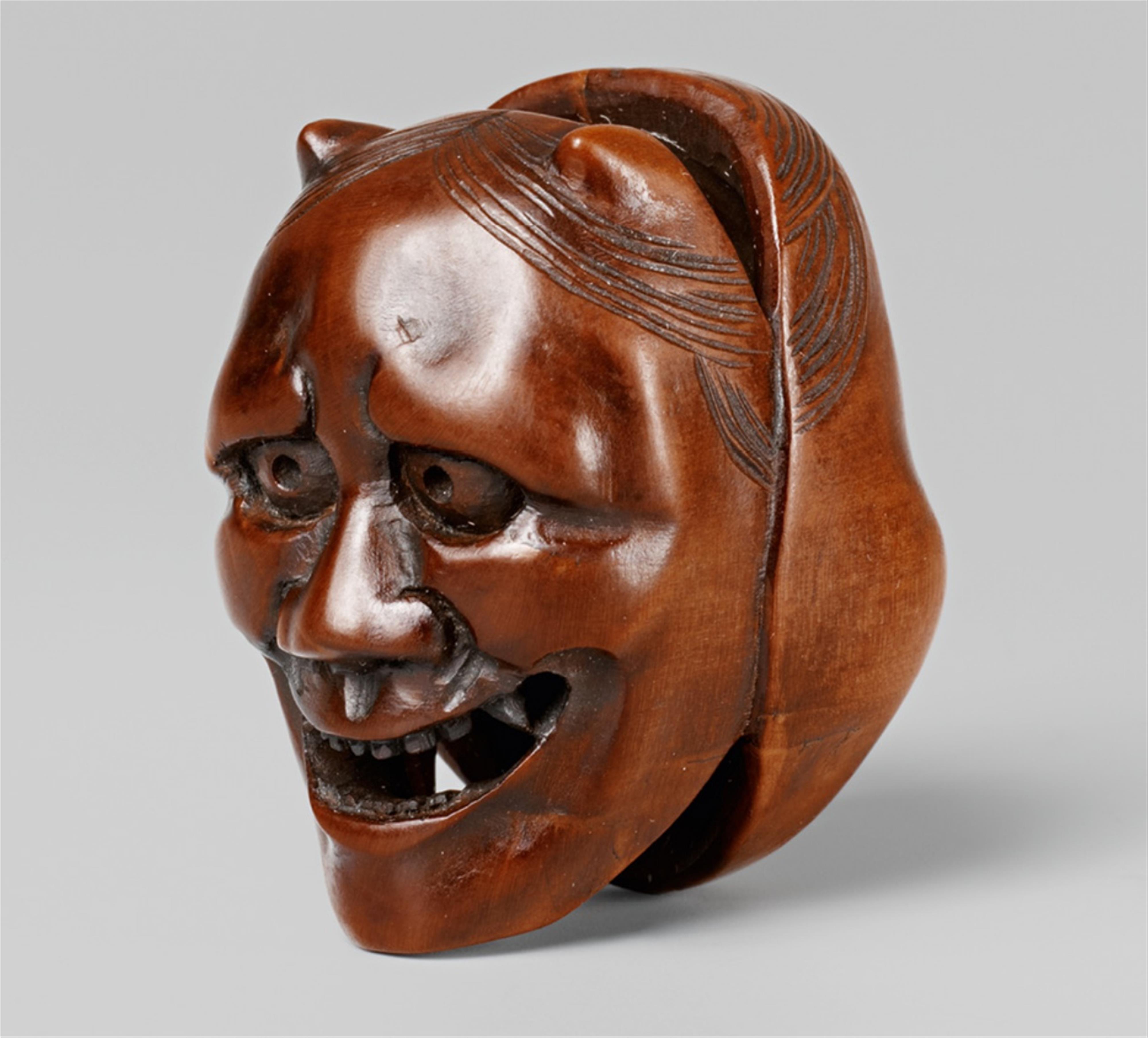A boxwood netsuke of two masks. Late 19th century - image-1