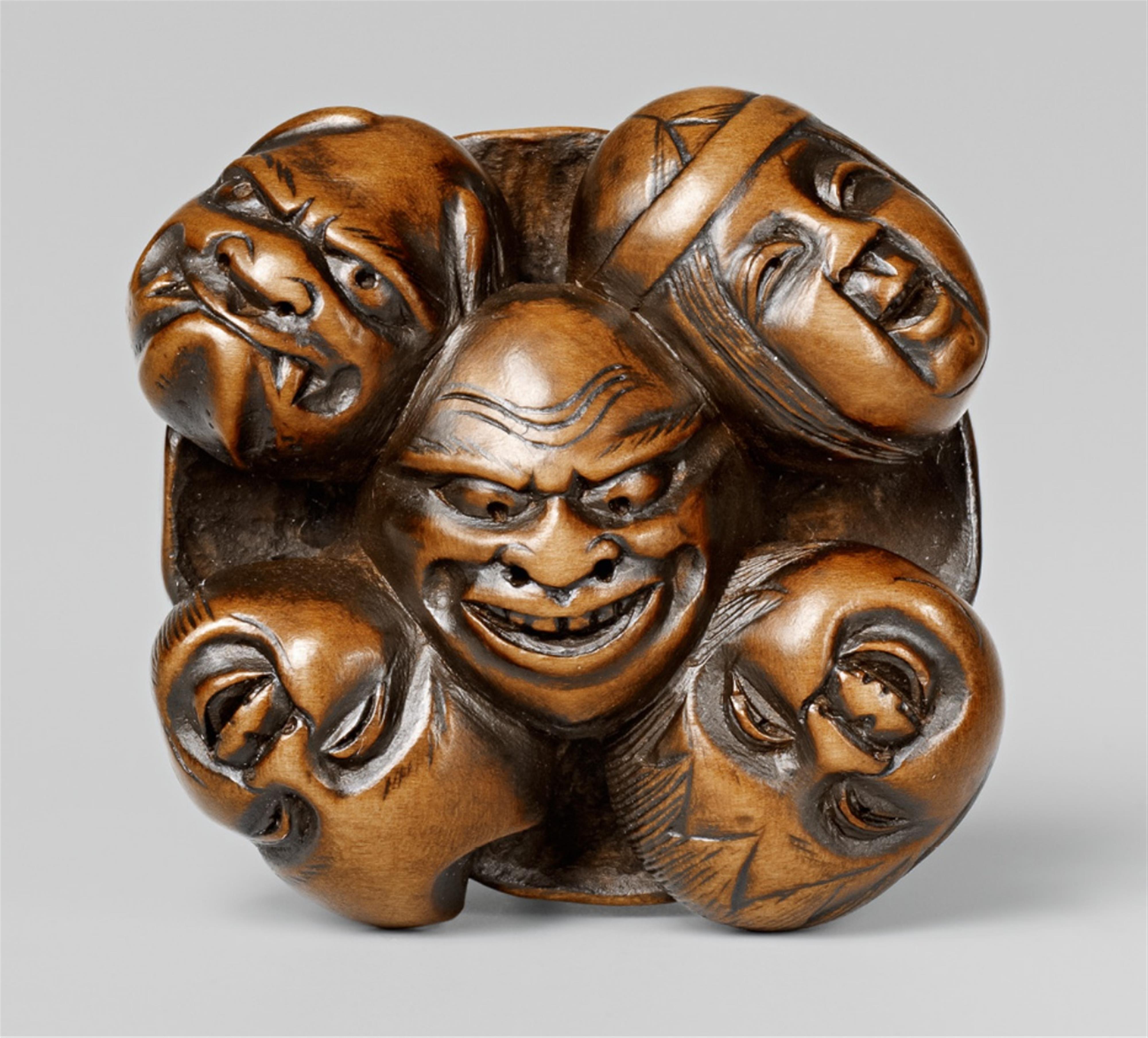 A small boxwood netsuke of nine masks. Second half 19th century - image-1