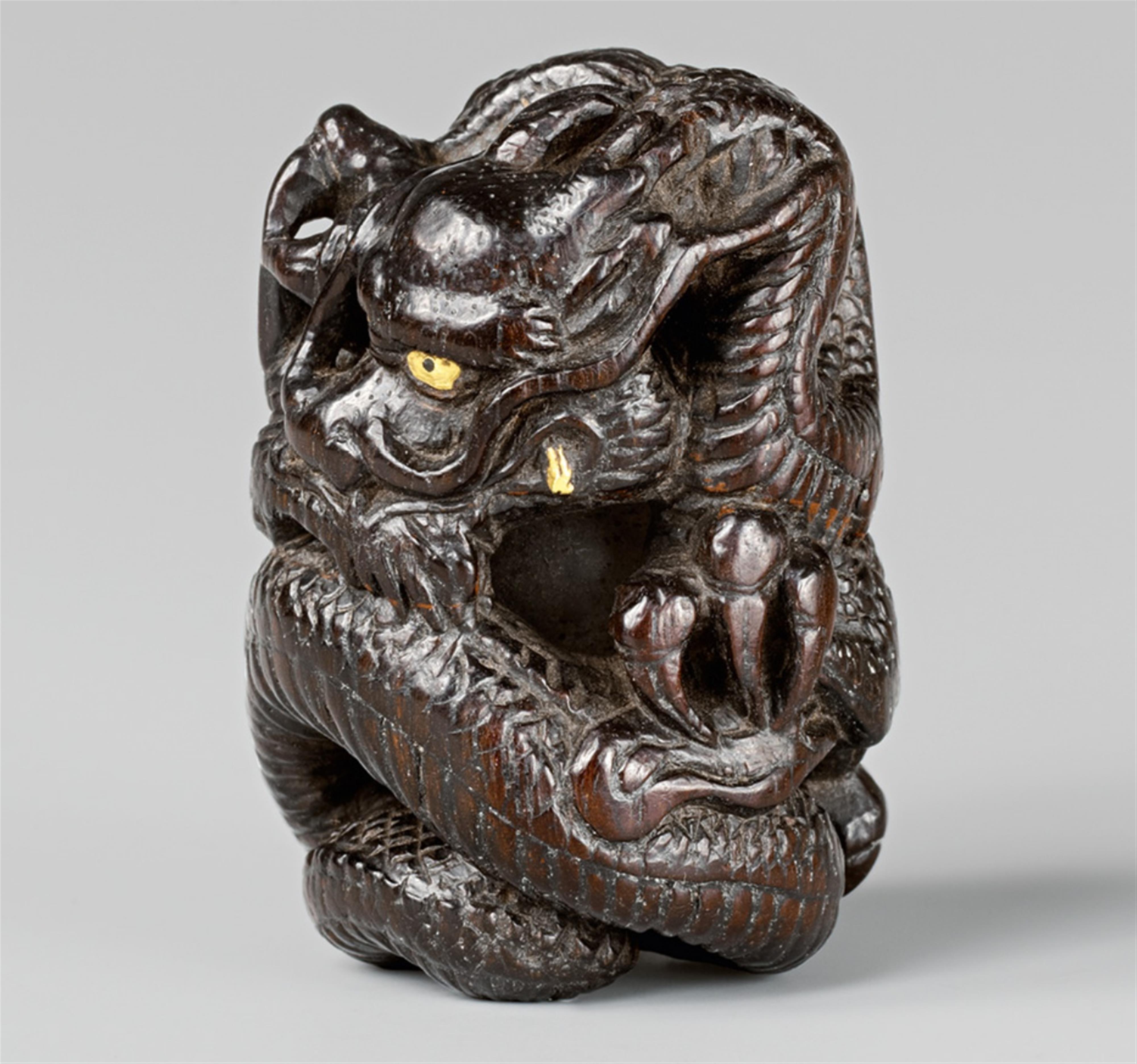 An unusual wood netsuke of a dragon with a loose ball, by Tankaku. Mid-19th century - image-1