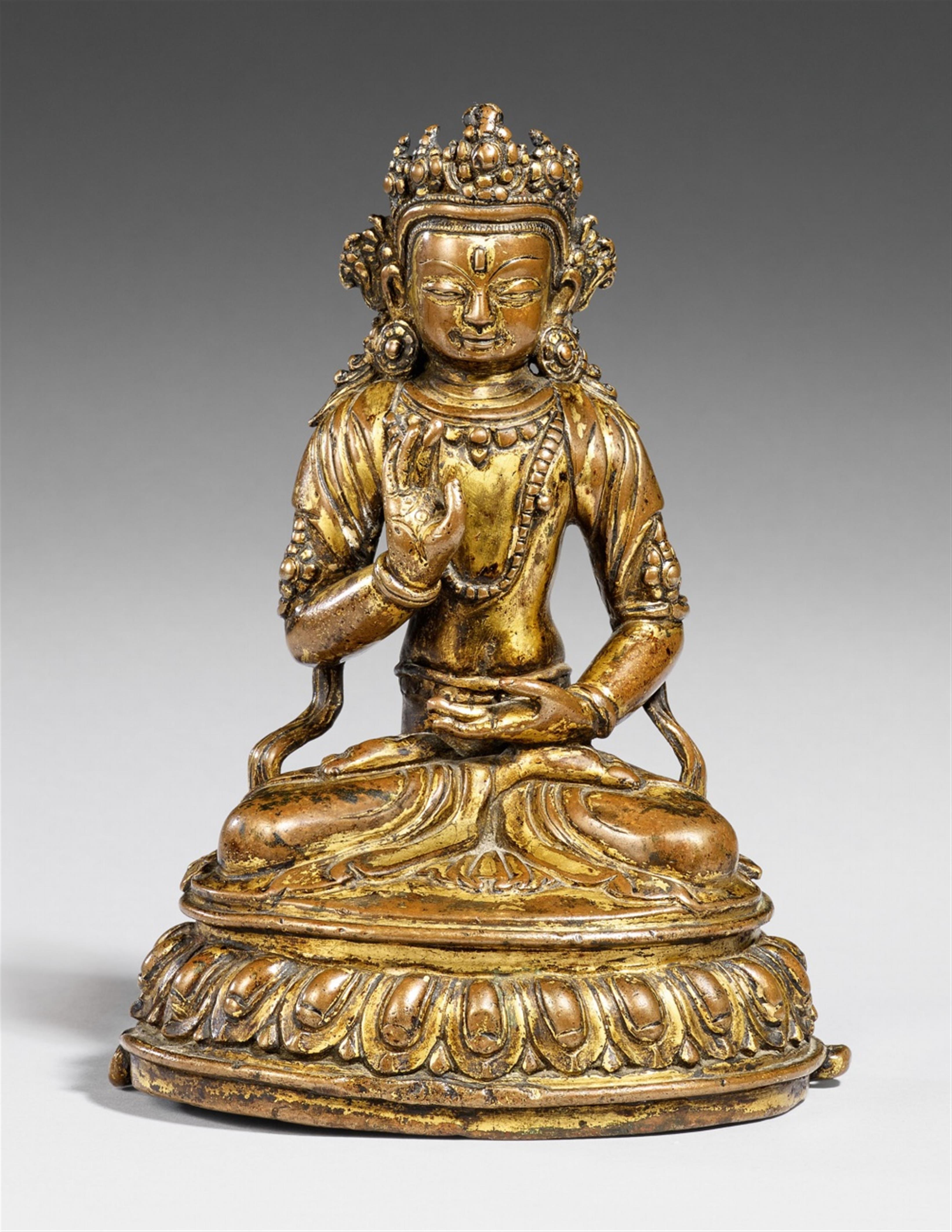 A Tibetan gilt copper figure of Buddha Amoghasiddhi. 15th century - image-1