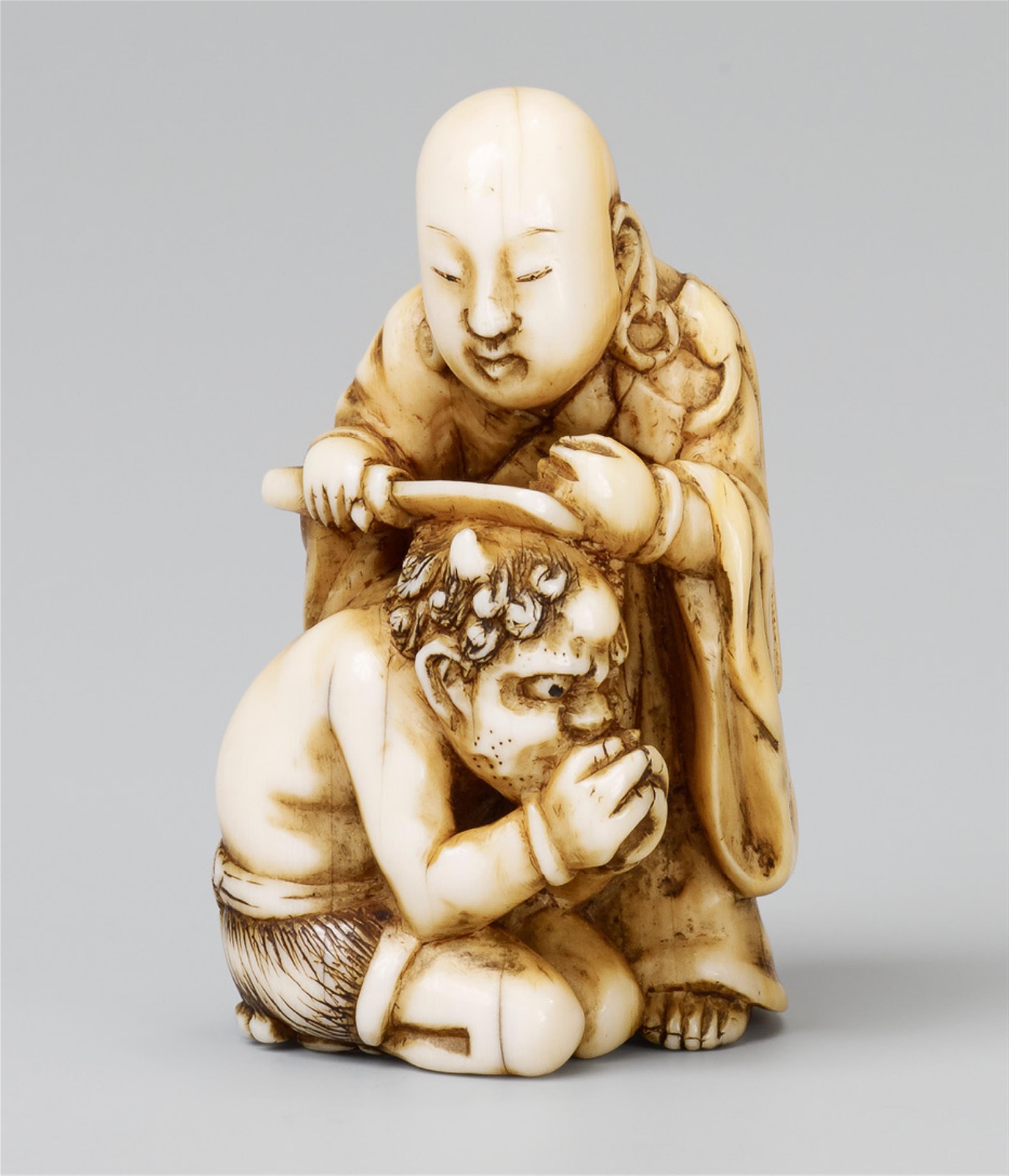 A Tokyo school ivory netsuke of a priest and an oni, by Tomochika. Late 19th century - image-1