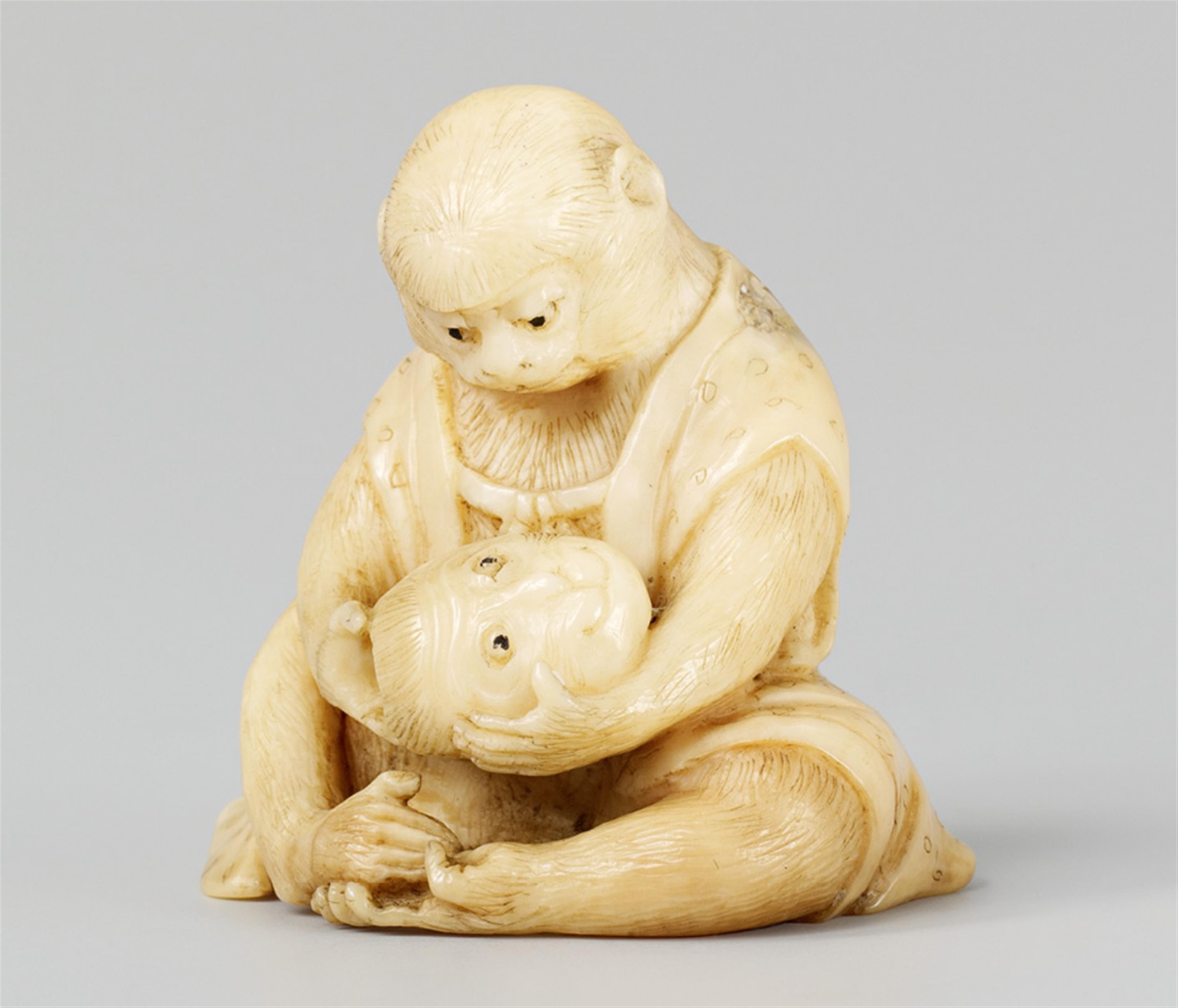 A marine ivory netsuke of a smiling monkey with a mask, by Teisai. Late 19th century - image-1