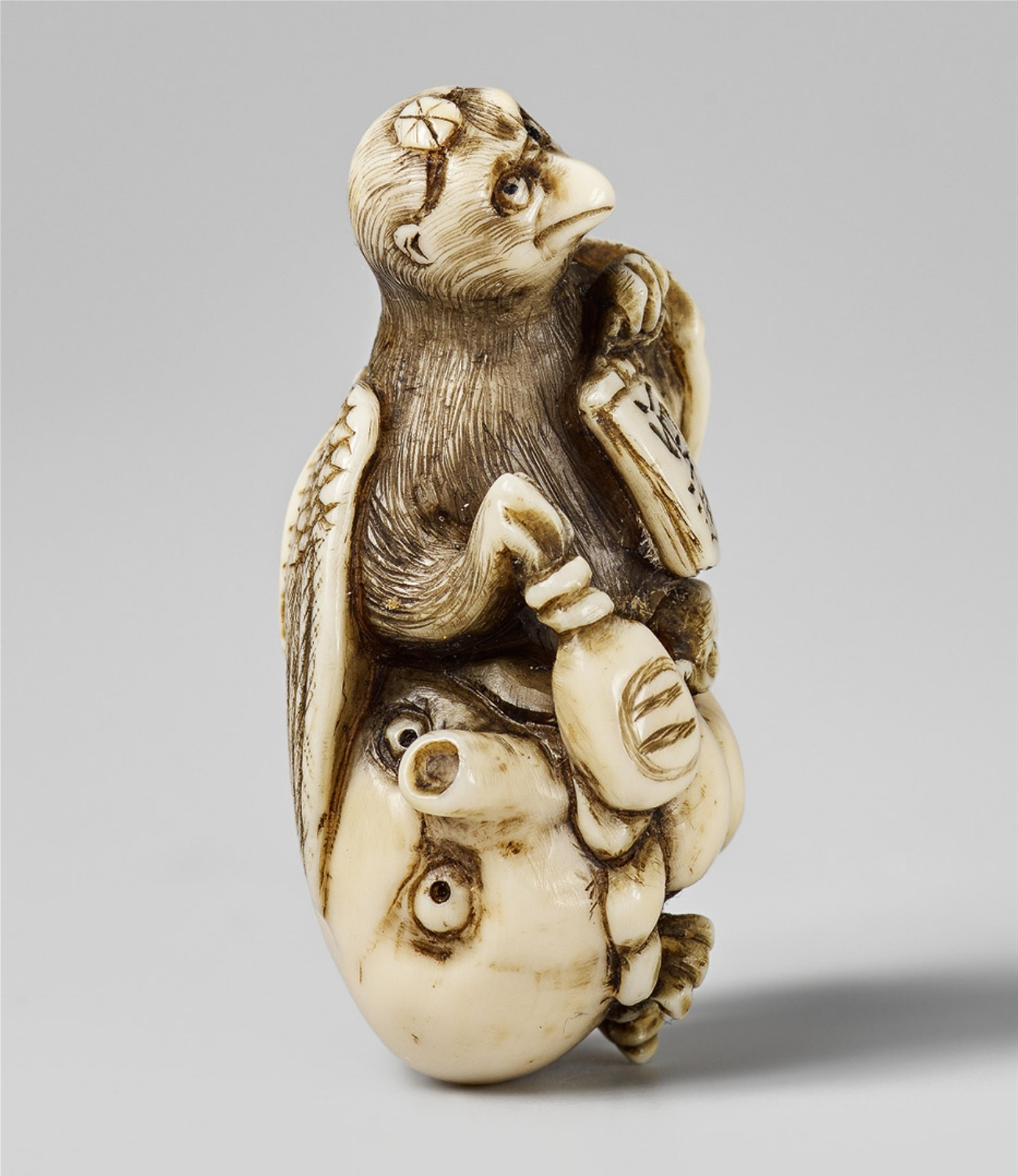A small amusing ivory netsuke of a tengu and an octopus. Late 19th century - image-1