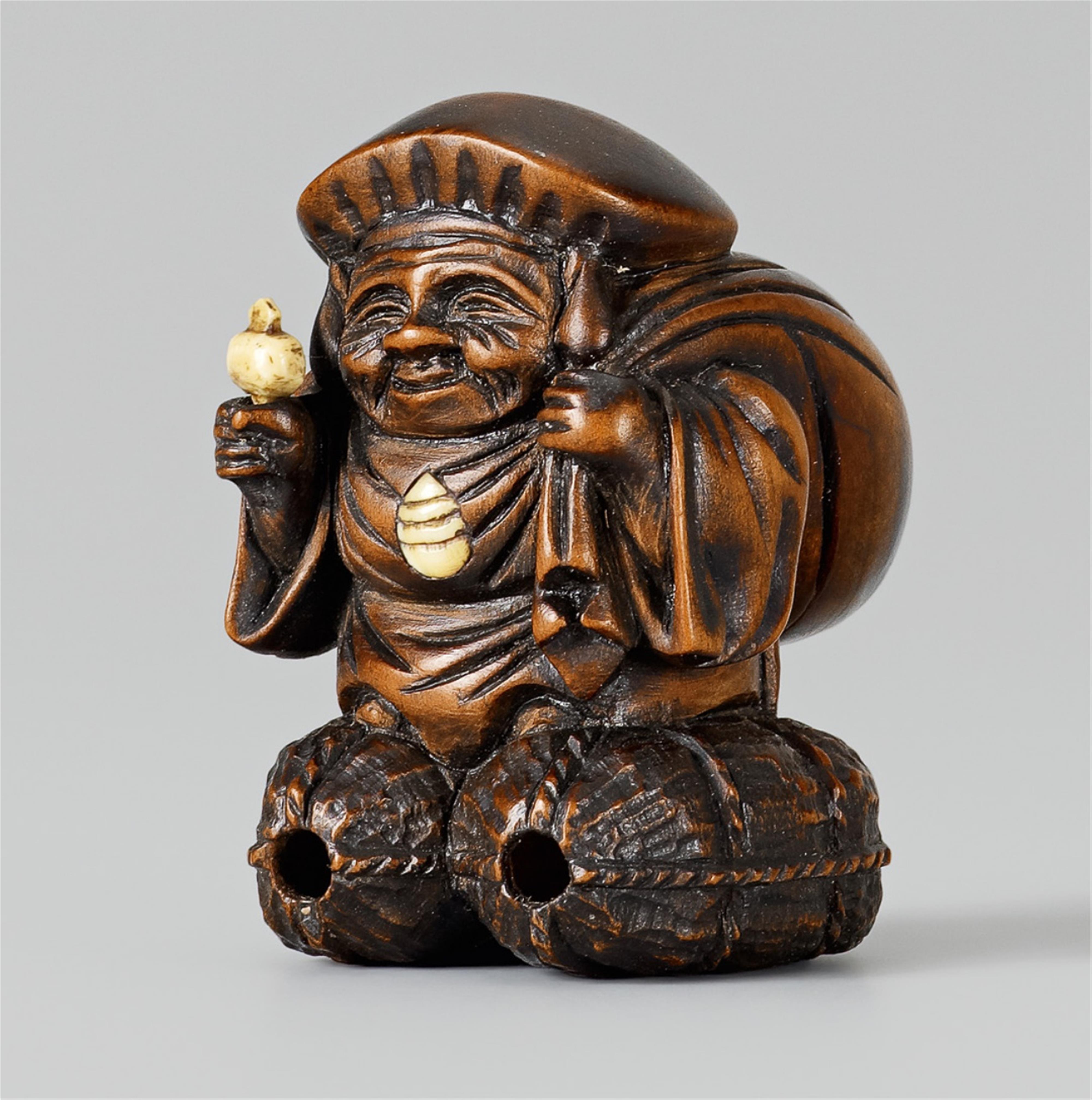 A small boxwood okimono of Daikoku. Second half 19th century - image-1