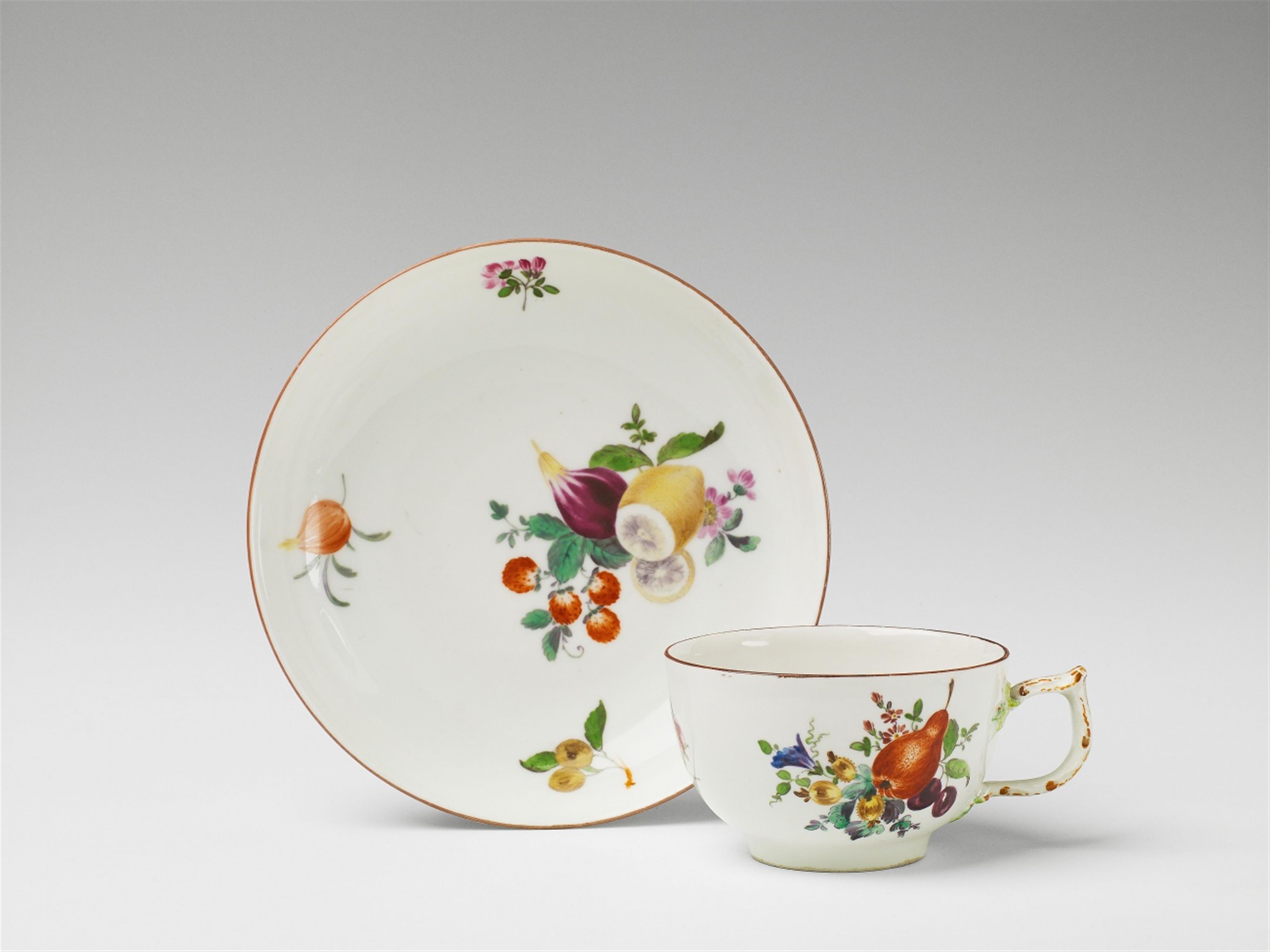 A Berlin KPM cup and saucer with fruit and flower decor - image-1